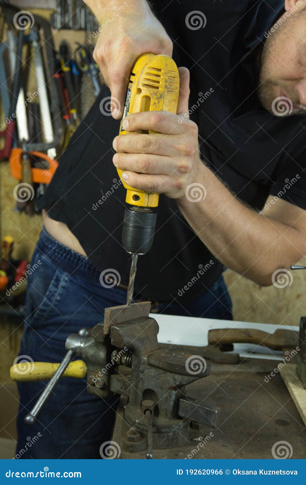 Working with a Vise and Drill. the Master Uses a Drill. Portrait of a