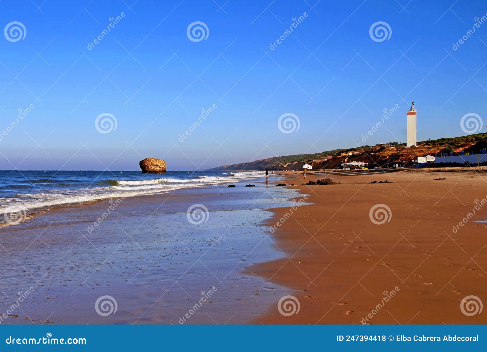 matalascaÃÂ±as beach with the lighthouse and the higuera tower