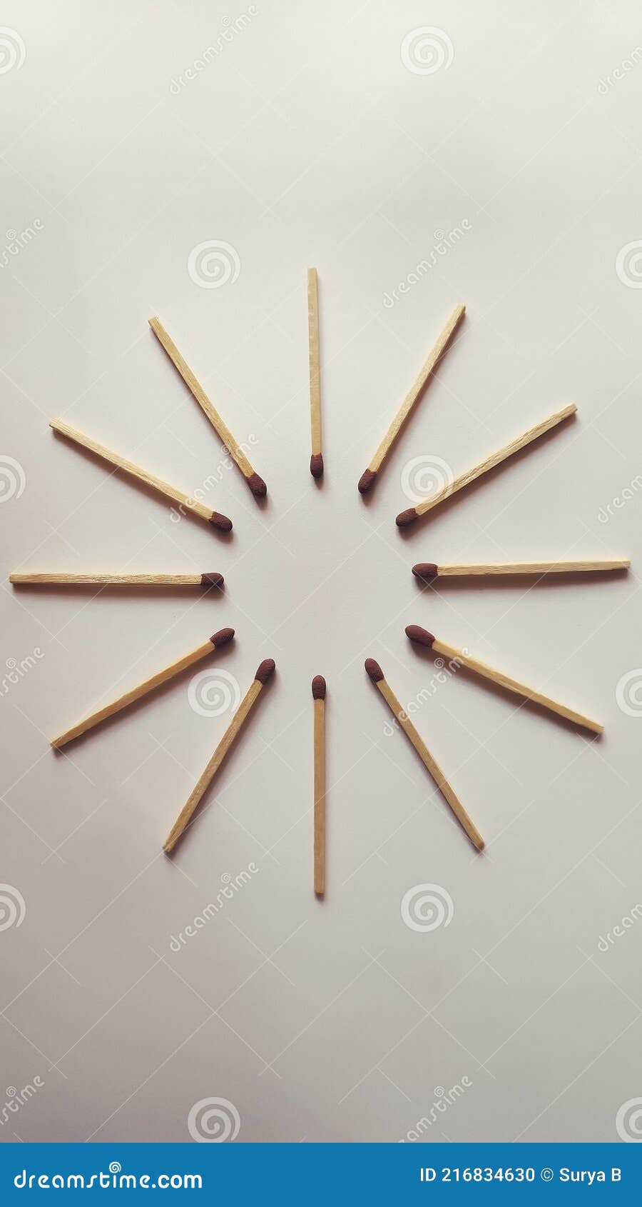 matchstick flat lay photography ideas, matchstick arranged like a sun.