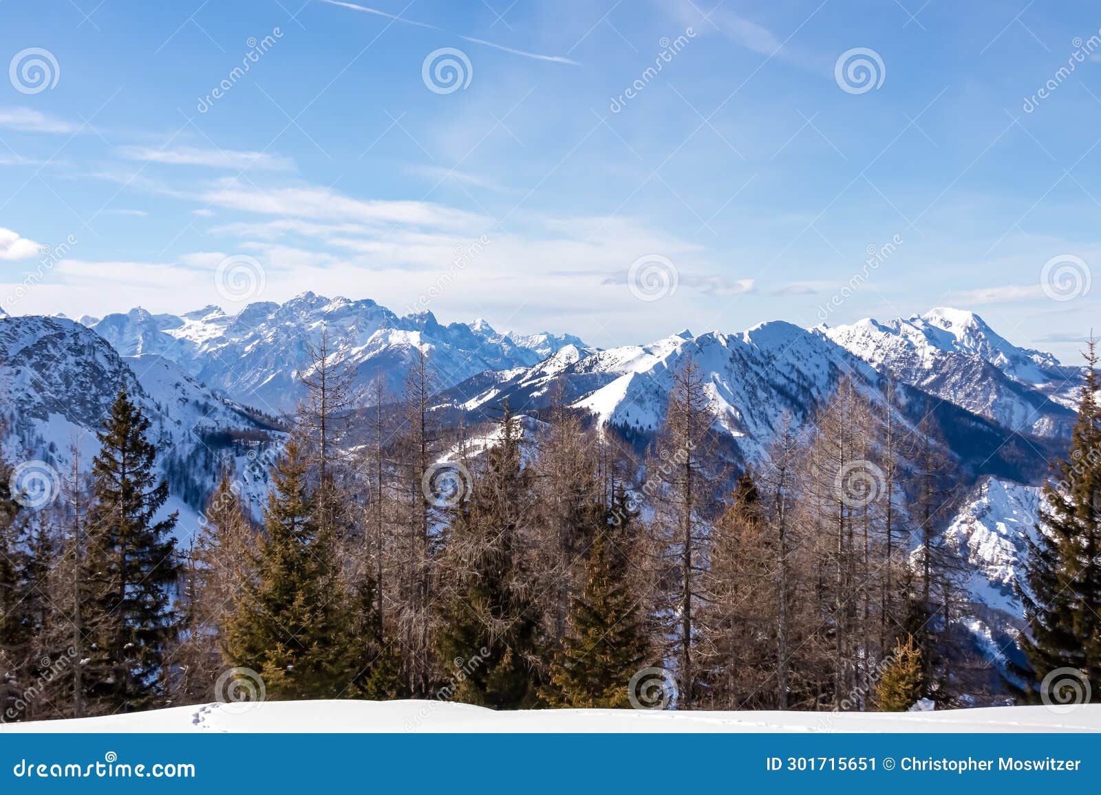 matschacher gupf - panoramic view on snow capped mountain peaks of karawanks and julian alps in carinthia