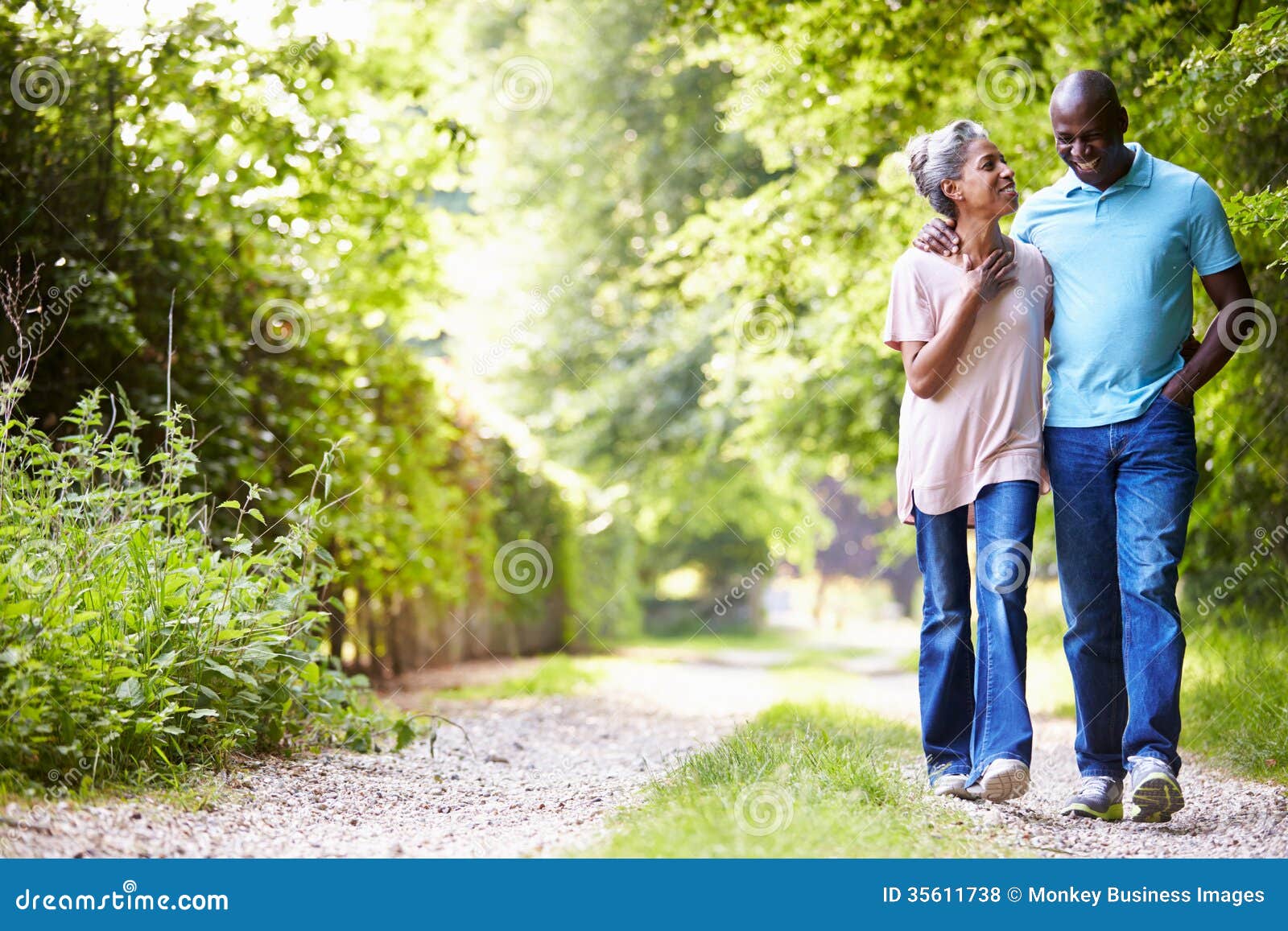 mature african american couple walking in countryside