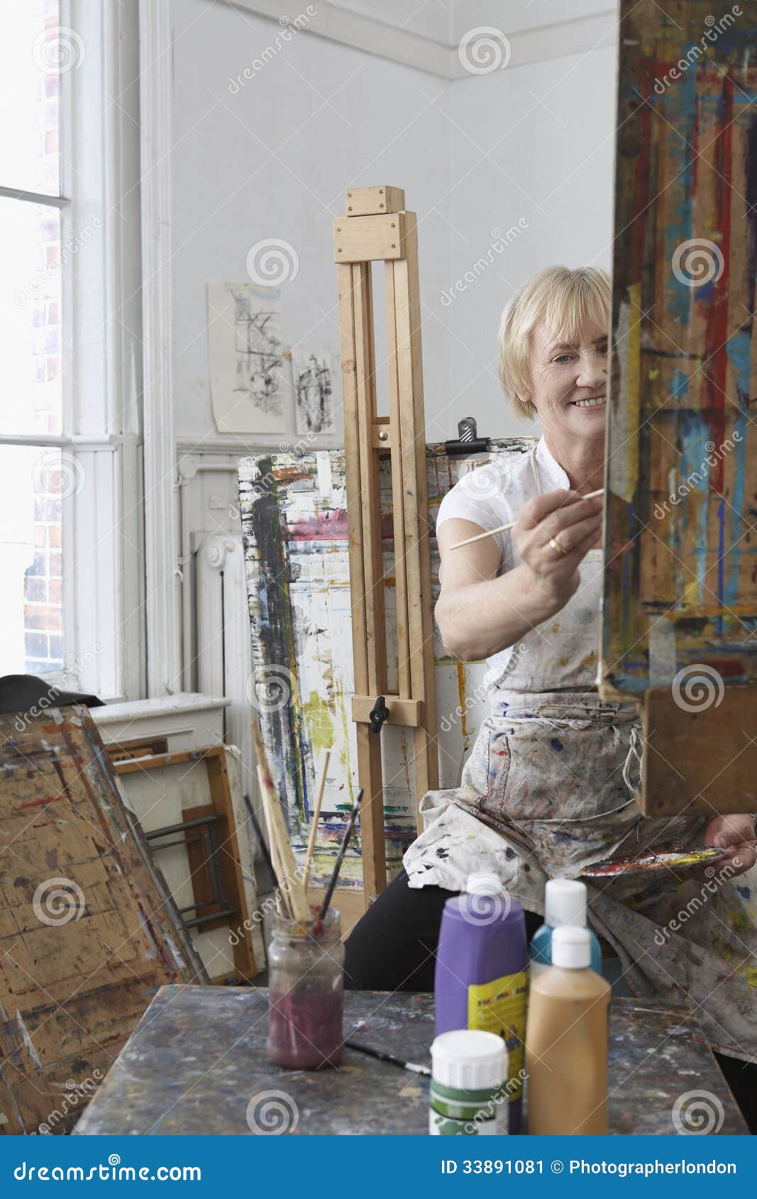 Mature Artist Painting In Art Studio Stock Image - Image ...
