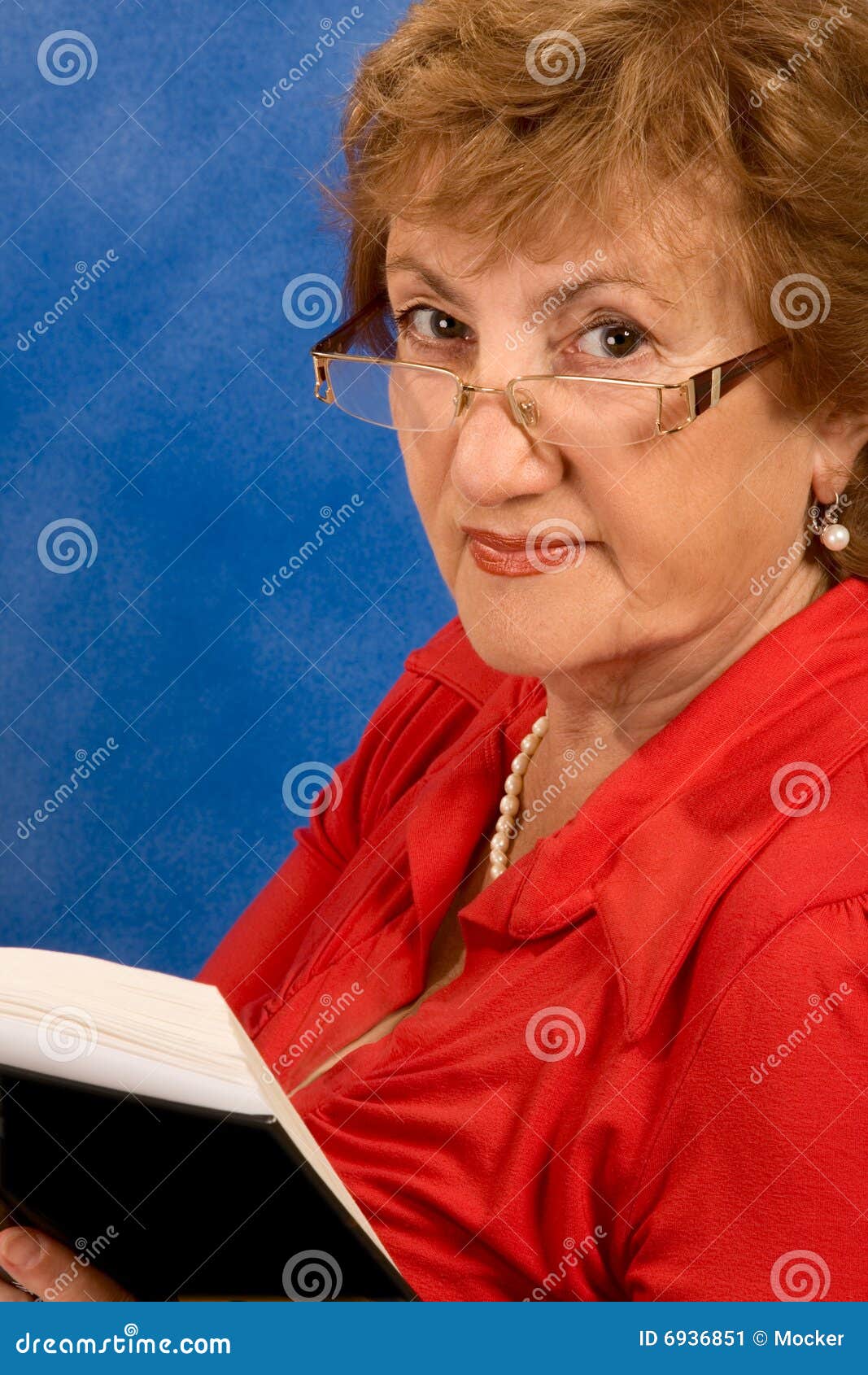 Mature Attractive Woman In Glasses Reading Book Stock