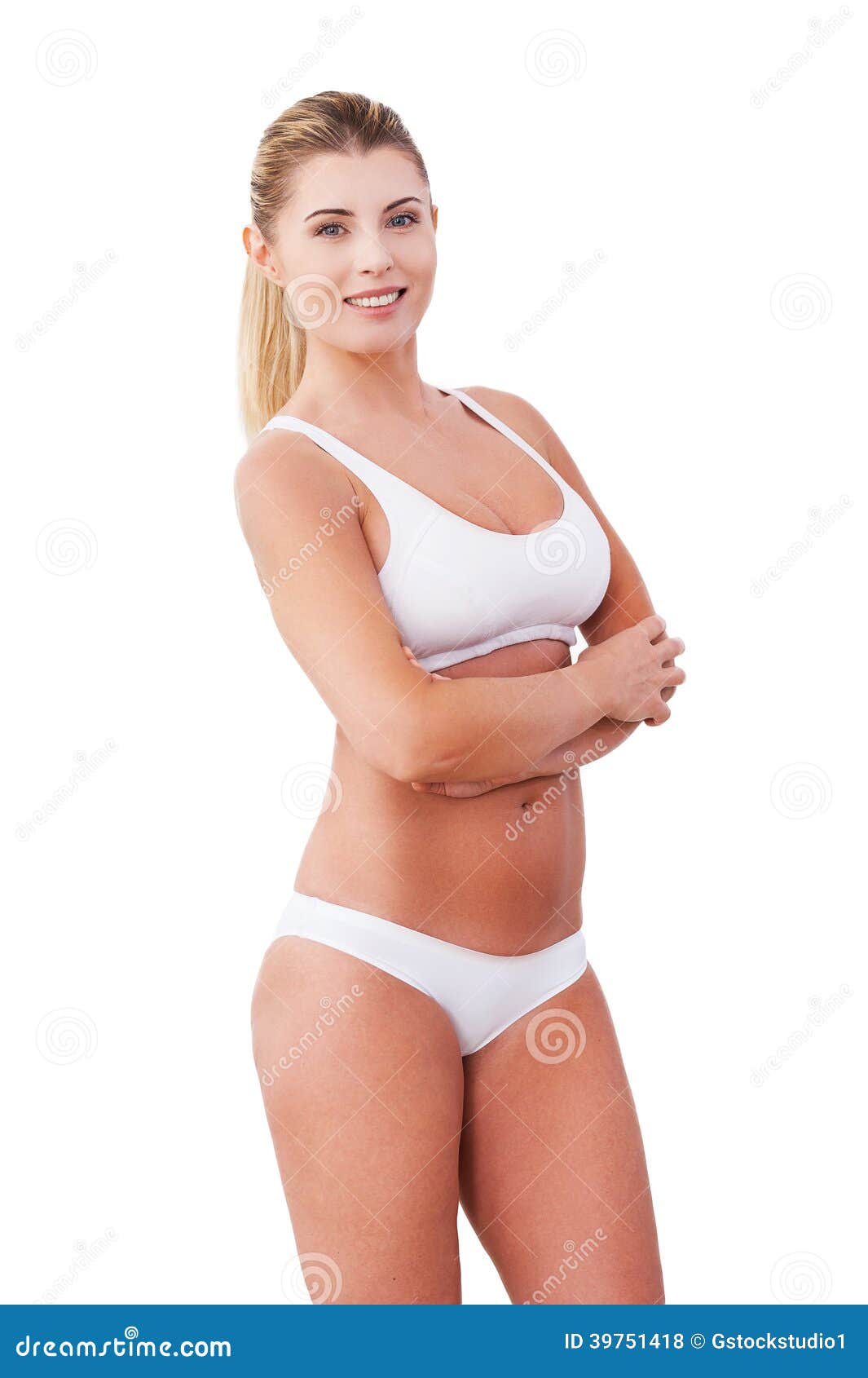 Foto de Young pretty woman on isilated background in white underwear.  Beautiful girl in perfectly clean underclothes do Stock