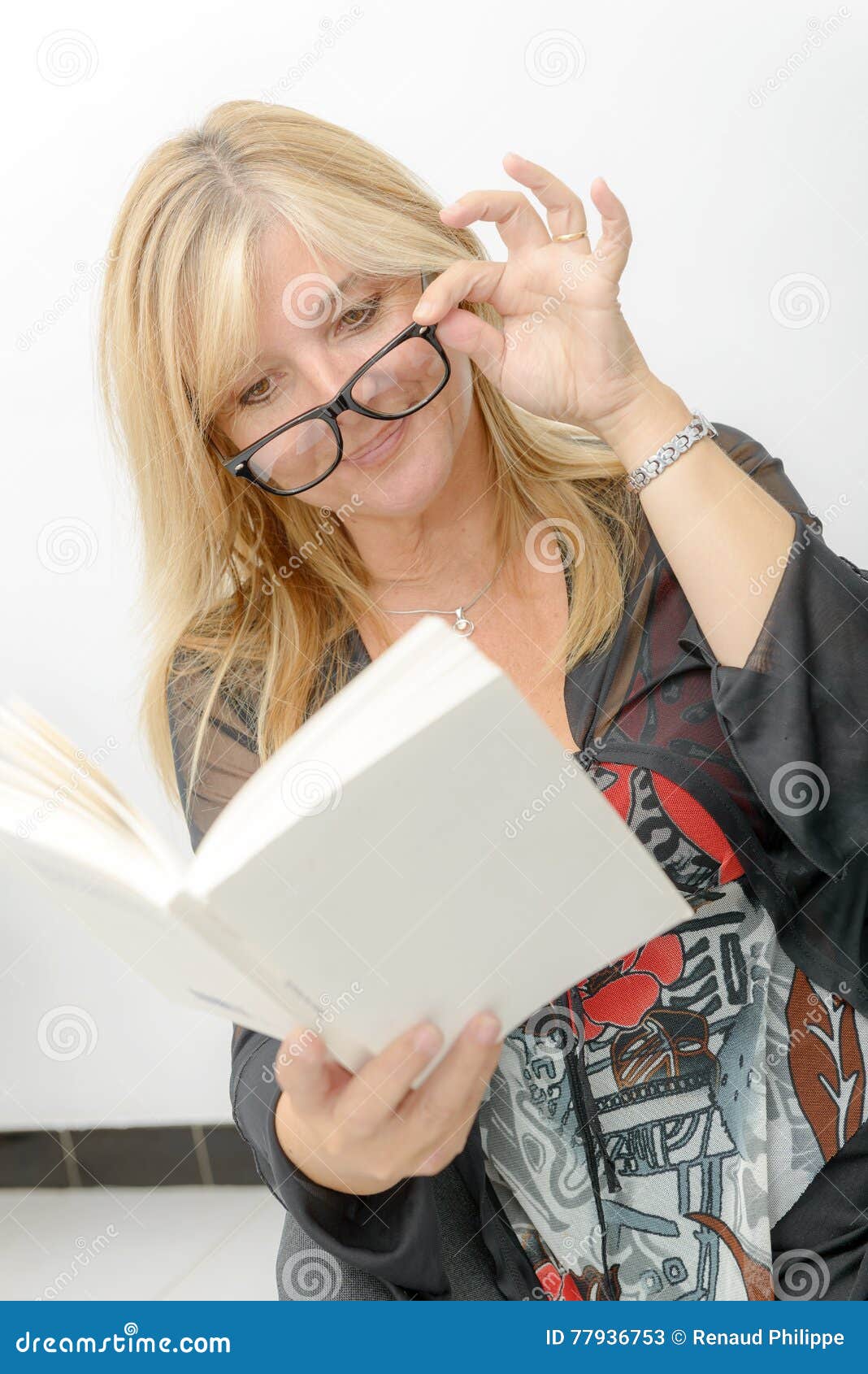 Mature Blond Woman Reading A Book Stock Image Image Of Mature Sitting 77936753
