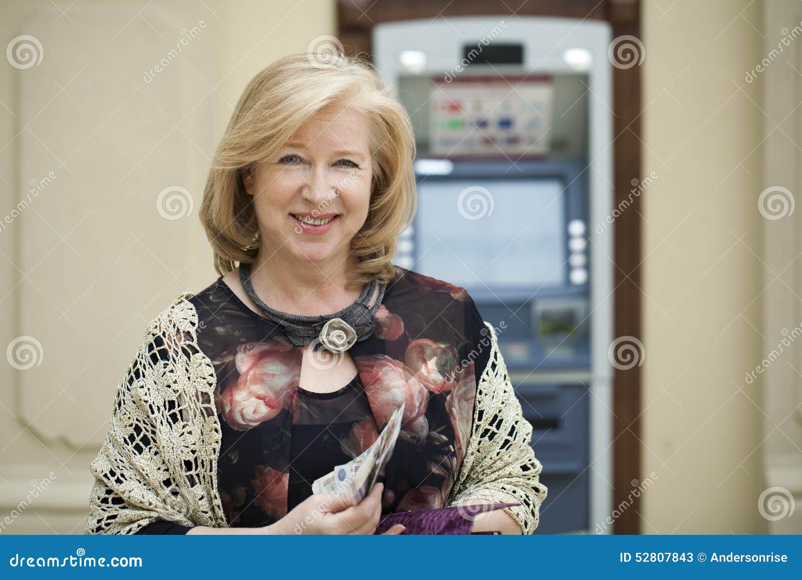 Mature Blonde Woman Counting Money Near ATM Stock Image - Image of