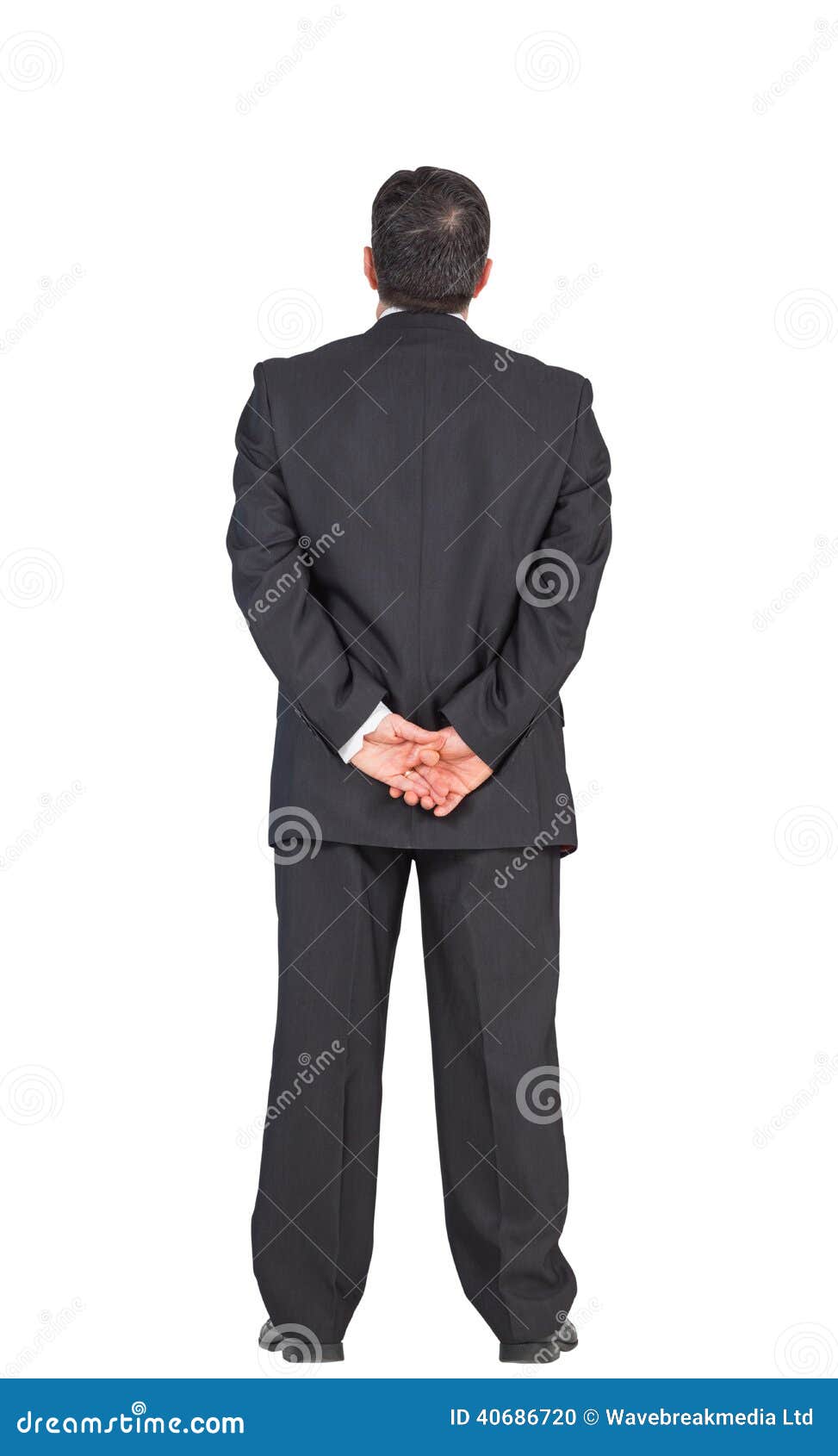 Mature Businessman Standing with Hands Behind Back Stock Photo - Image ...