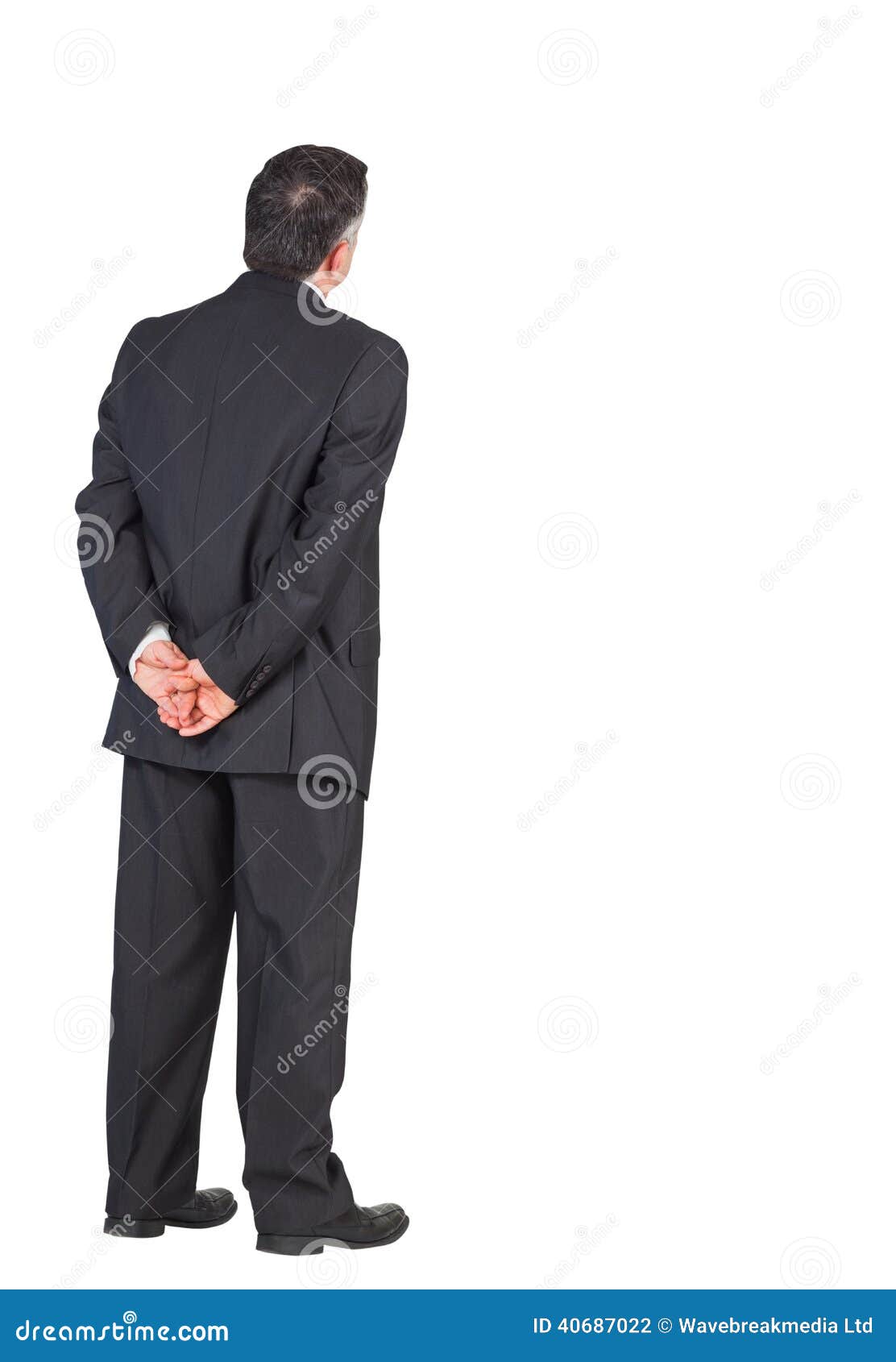 Mature Businessman Standing With Hands Behind Back Stock Photo - Image ...