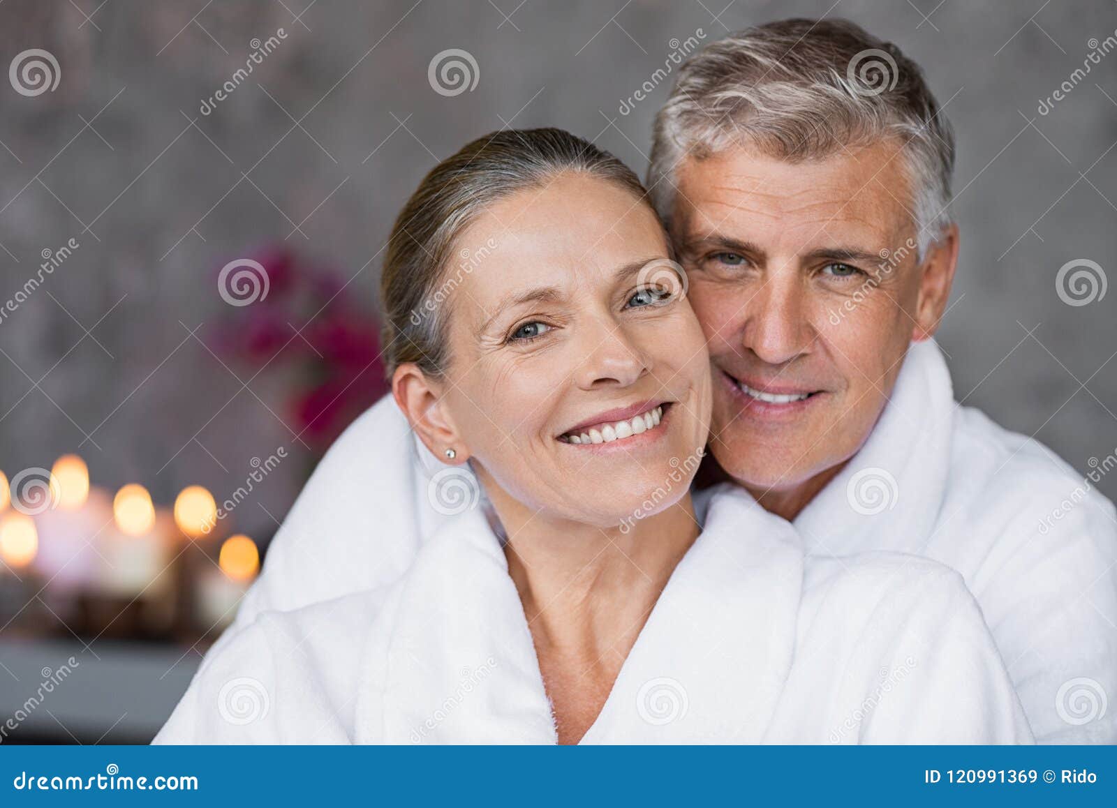 mature couple in bathrobe at spa