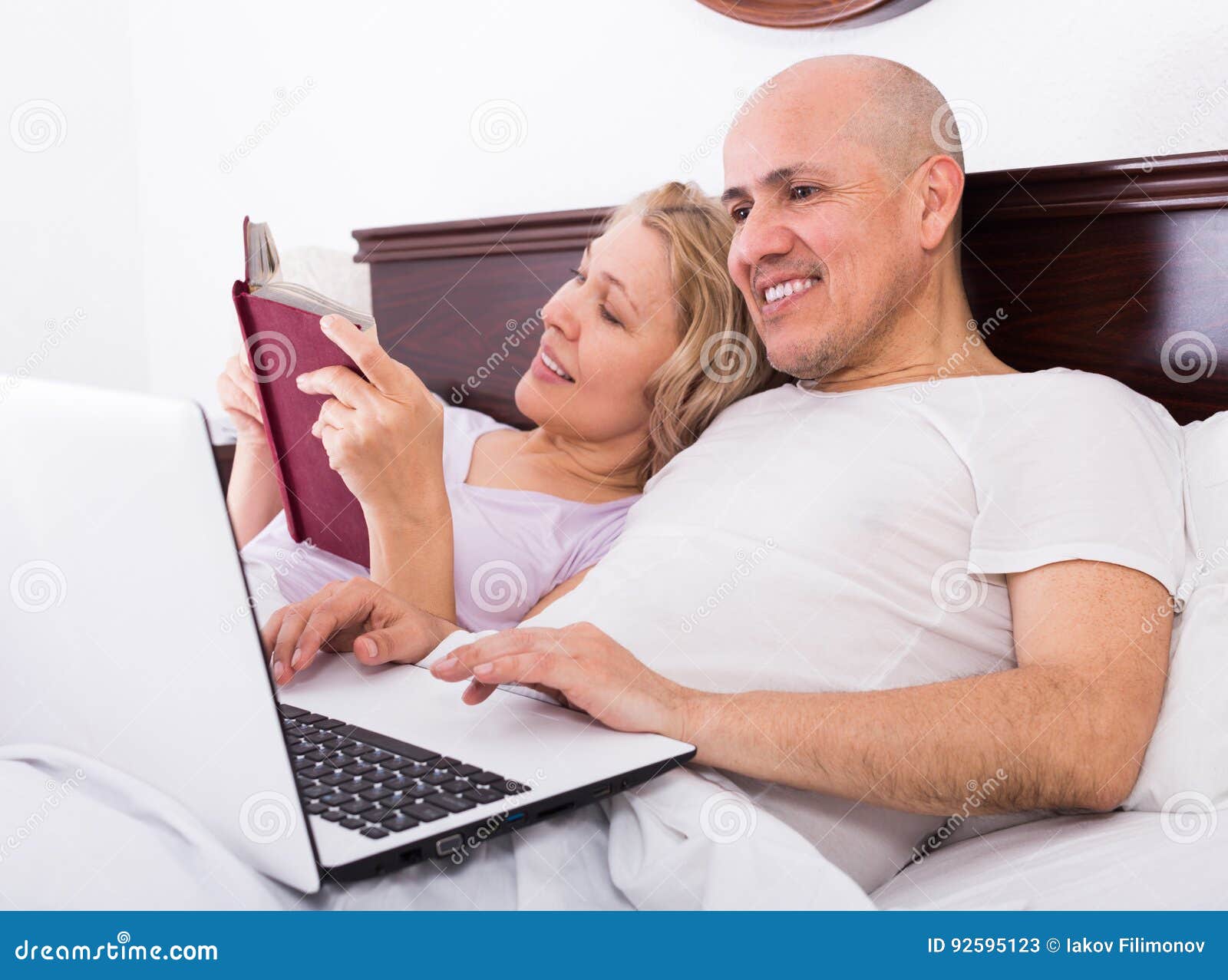 Mature Couple In Bed With Laptop Stock Image Image Of