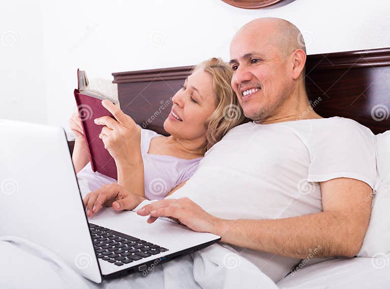 Mature Couple In Bed With Laptop Stock Image Image Of Male Comfortable 92595123