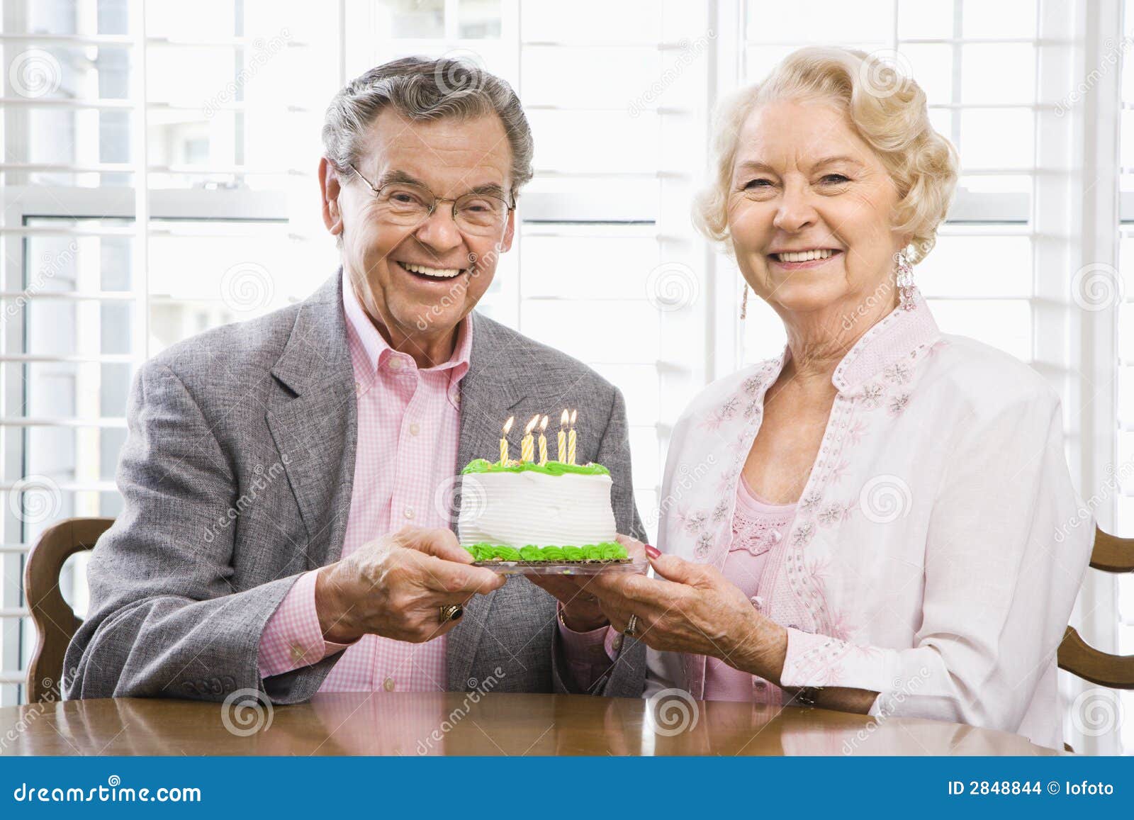 Mature couple with cake. stock photo. Image of male, horizontal 2848844