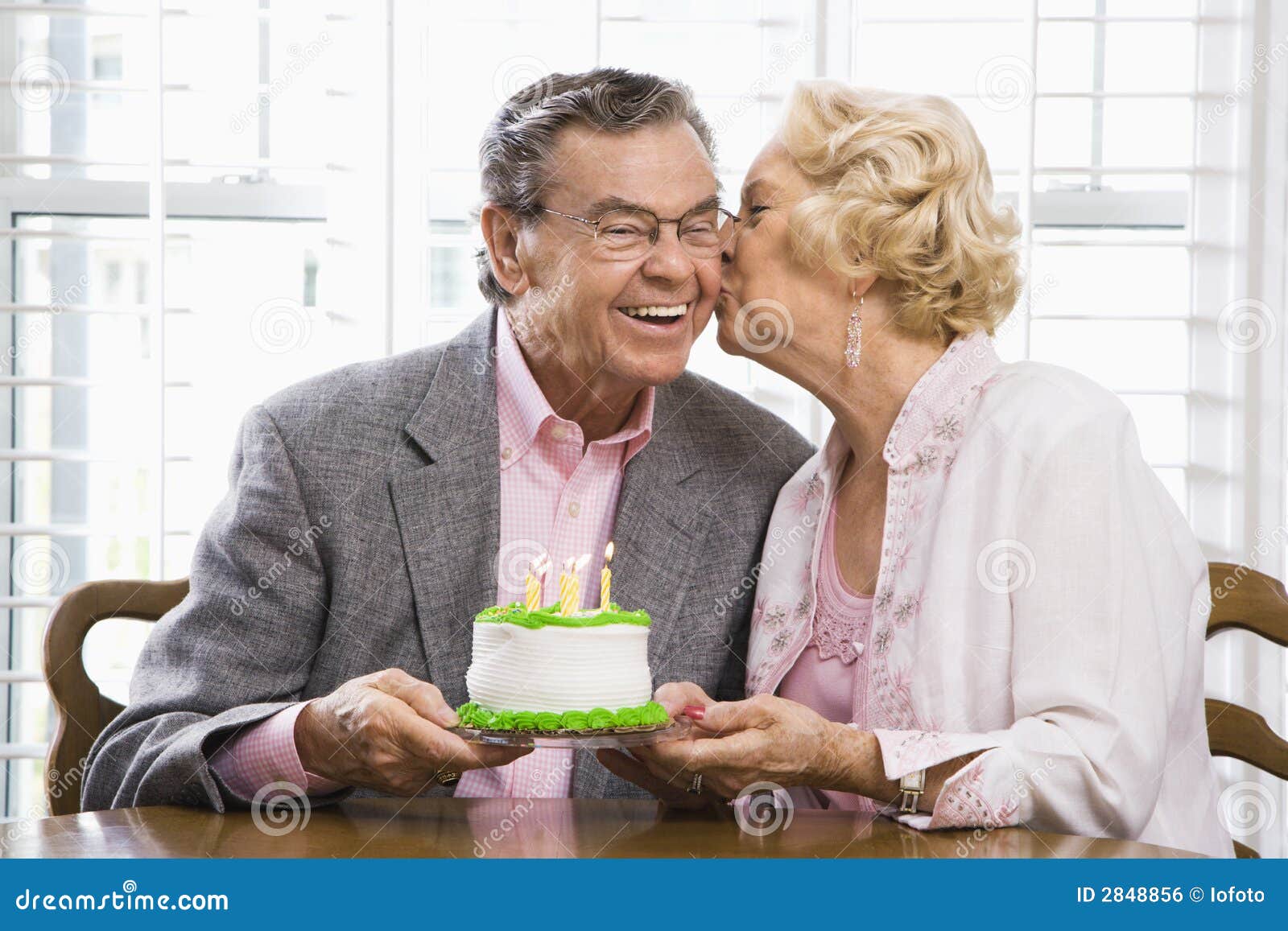 Mature couple with cake. stock photo. Image of birthday 2848856