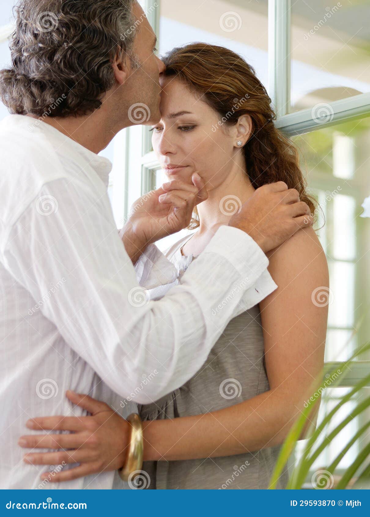 Mature Couple Hugging At Home Stock Photo Image