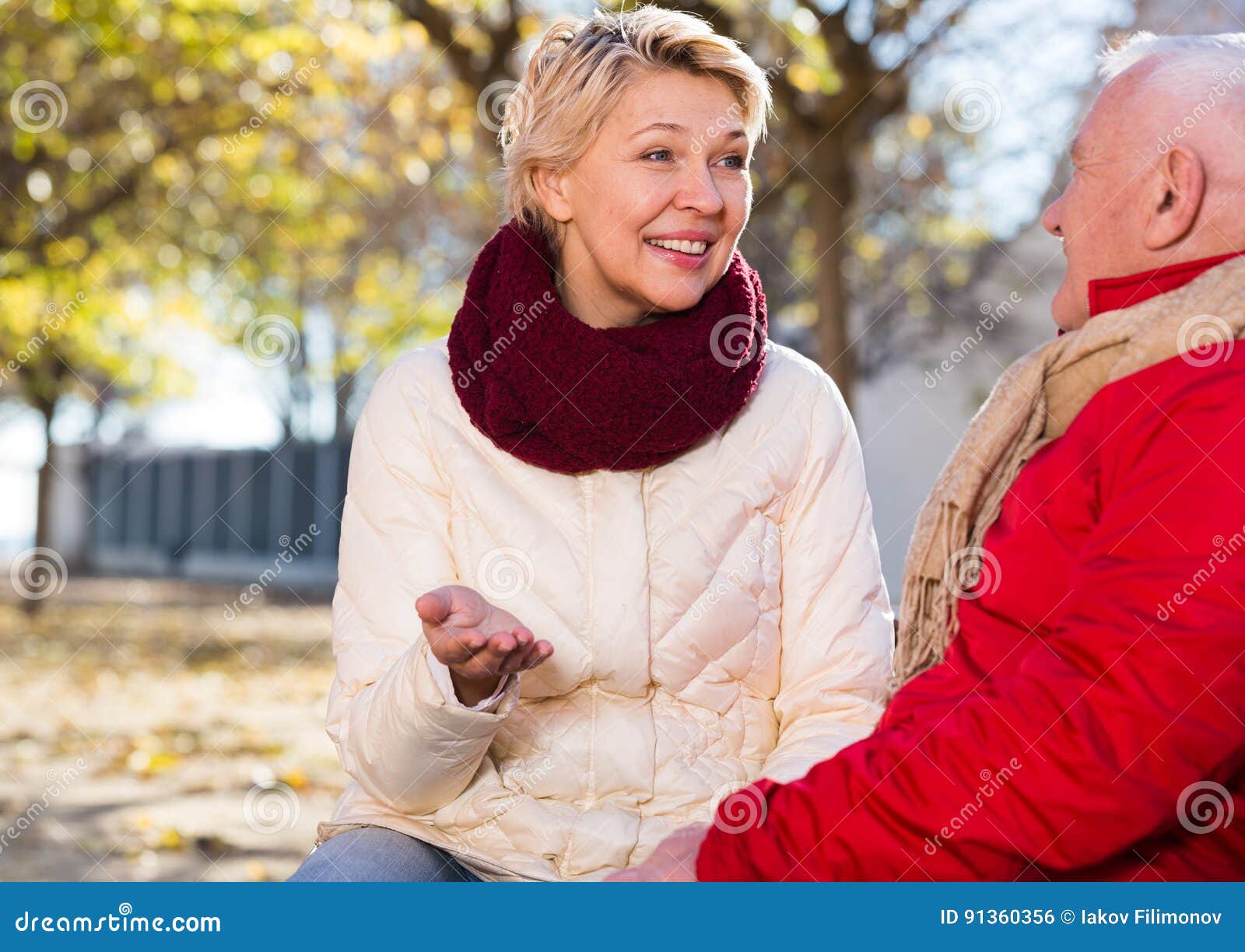 Mature Couple Talking in Park Stock Photo Image of aged, husband
