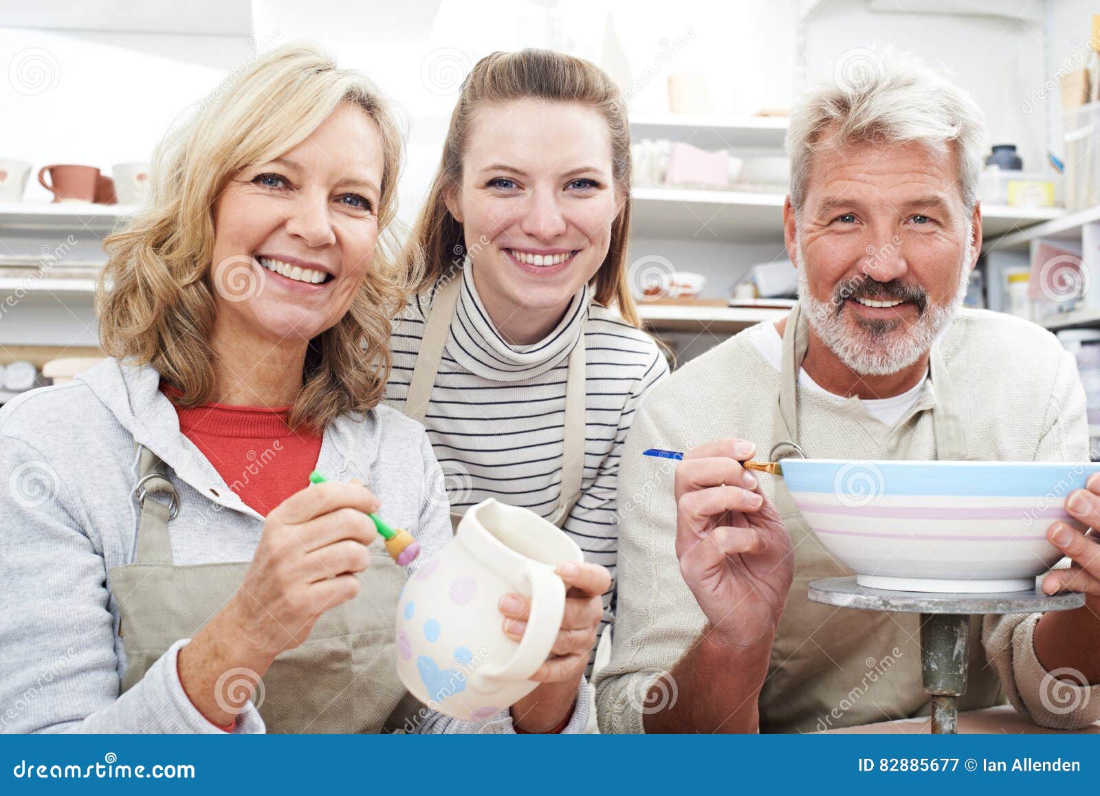 Mature Couple with Teacher in Pottery Class Stock Image Image of