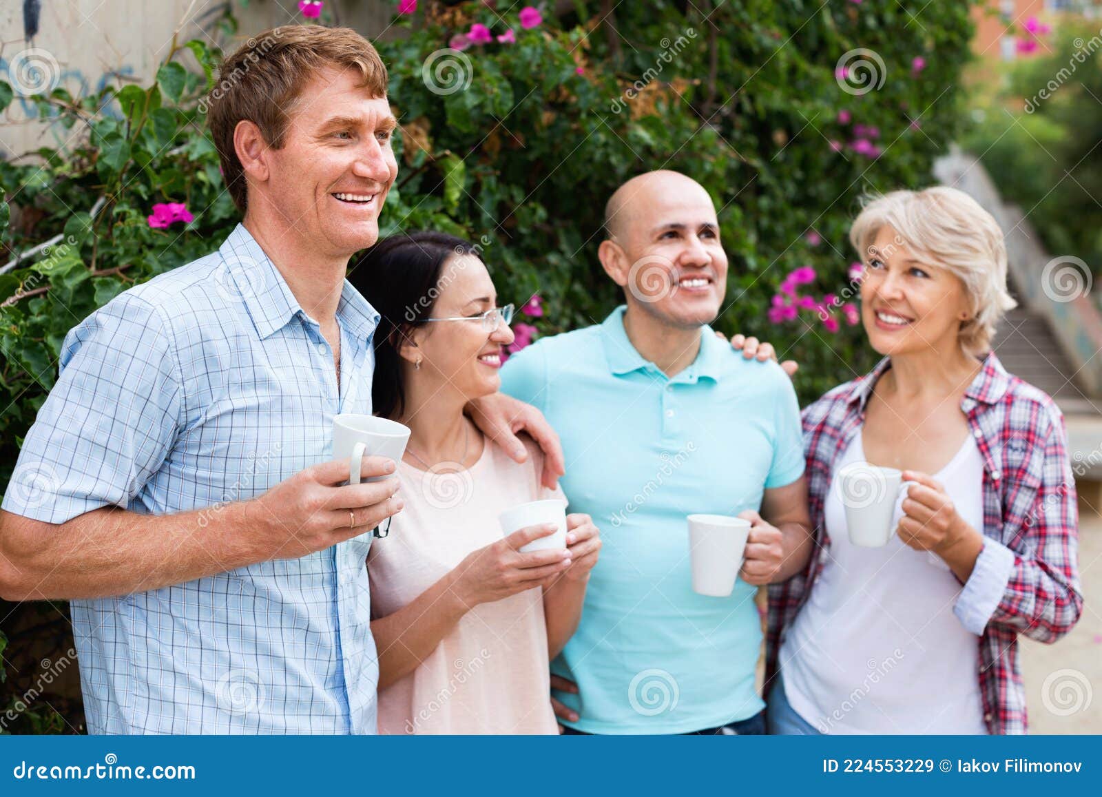 Mature Couples Walking And Drinking Coffee On Holiday Stock Image Image Of Talking Leisure