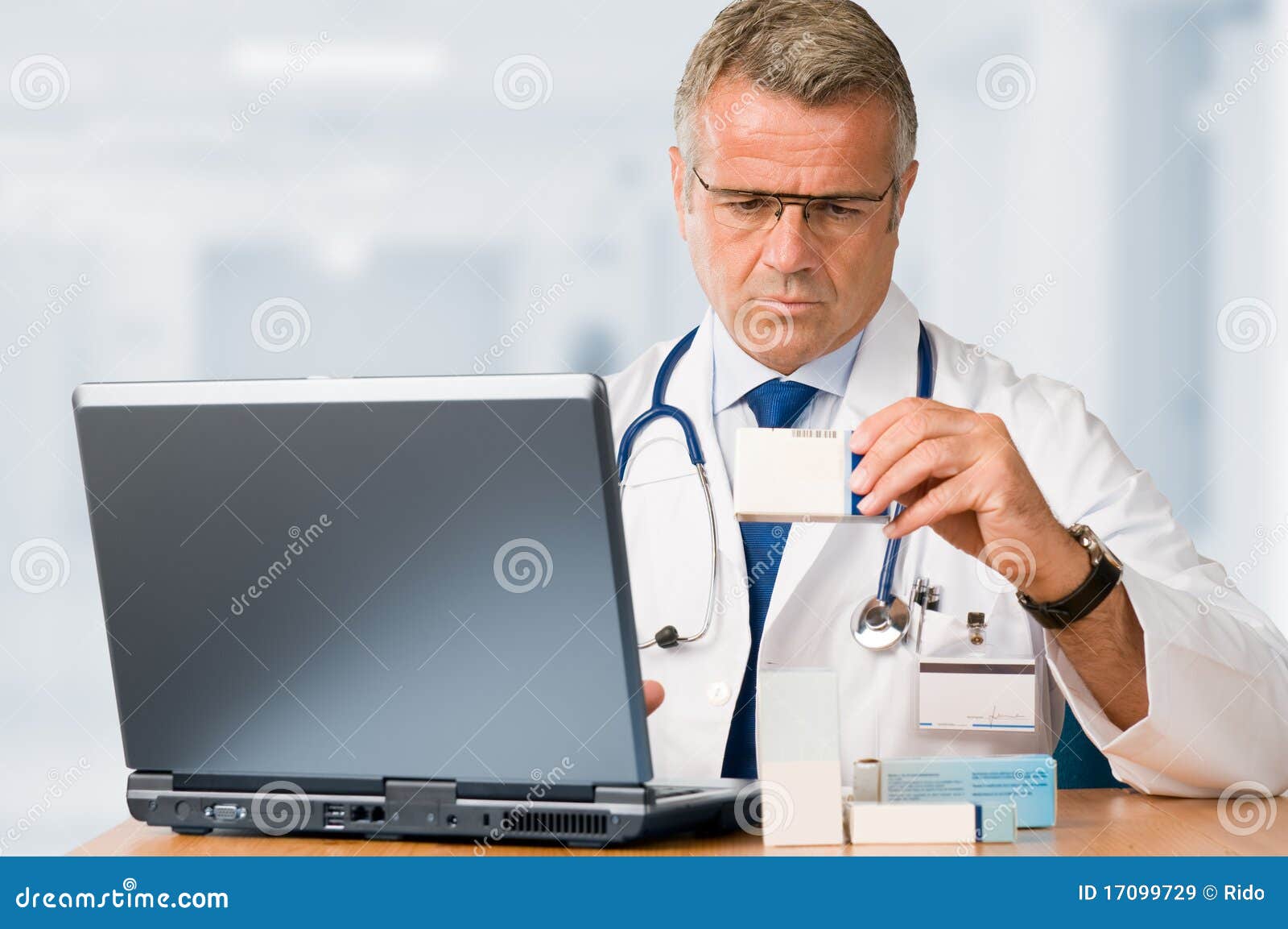 Mature Doctor Check Some Medicines Stock Image - Image of doctor, pill ...