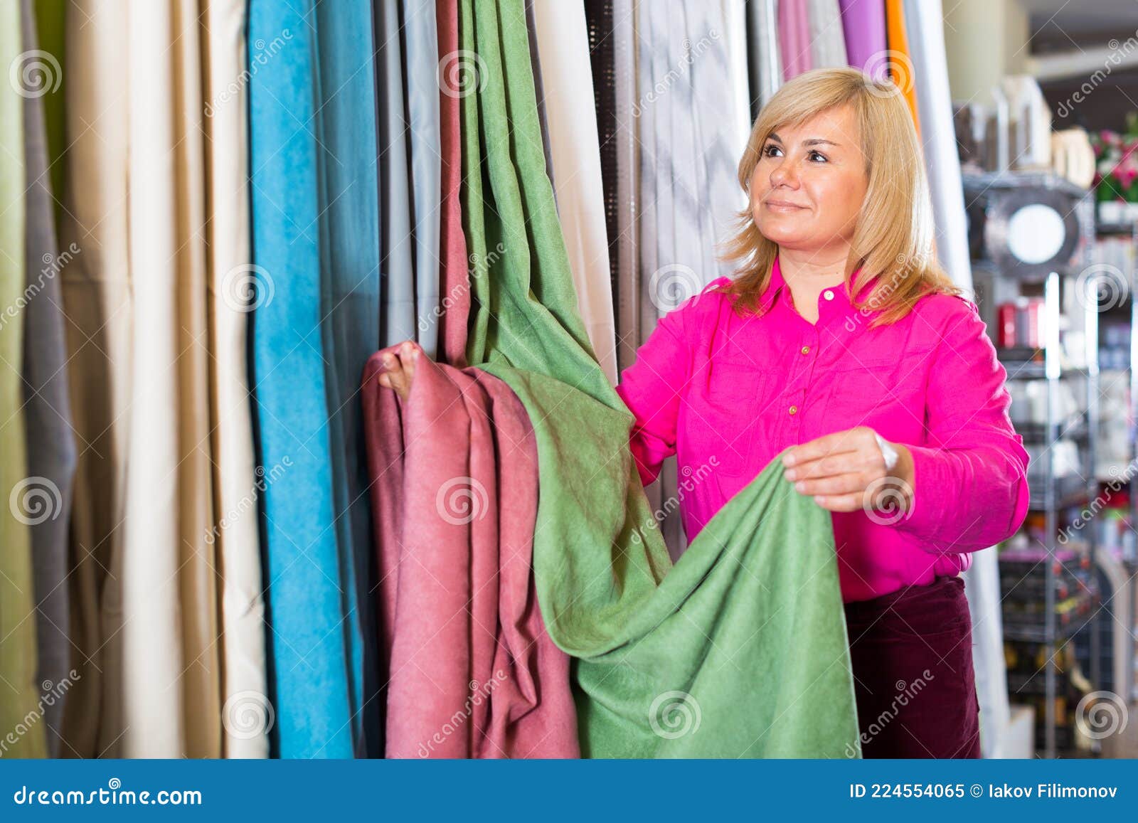 Mature Female Choosing Curtains in the Curtains Shop Stock Image ...