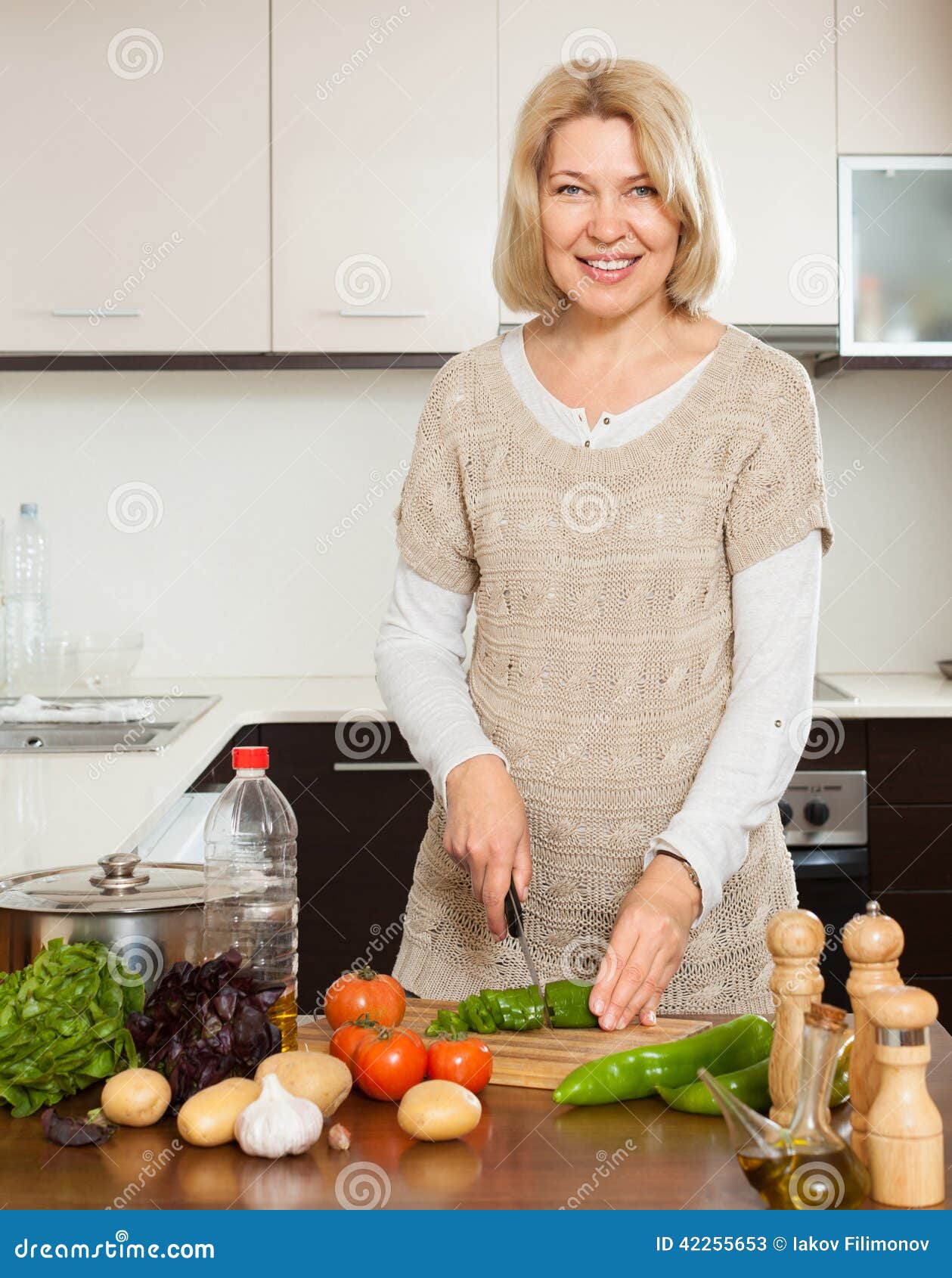 Mature Housewife Cooking With Veggy Lunch Stock Im