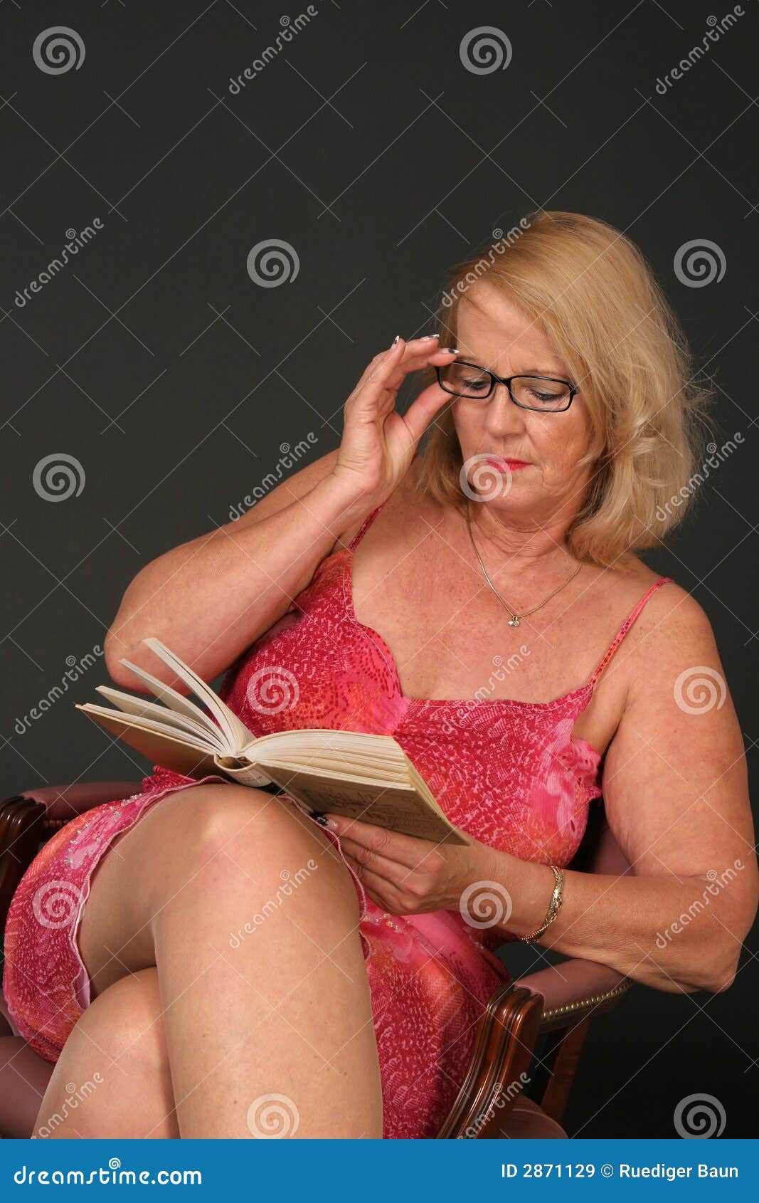 Mature lady reading stock image