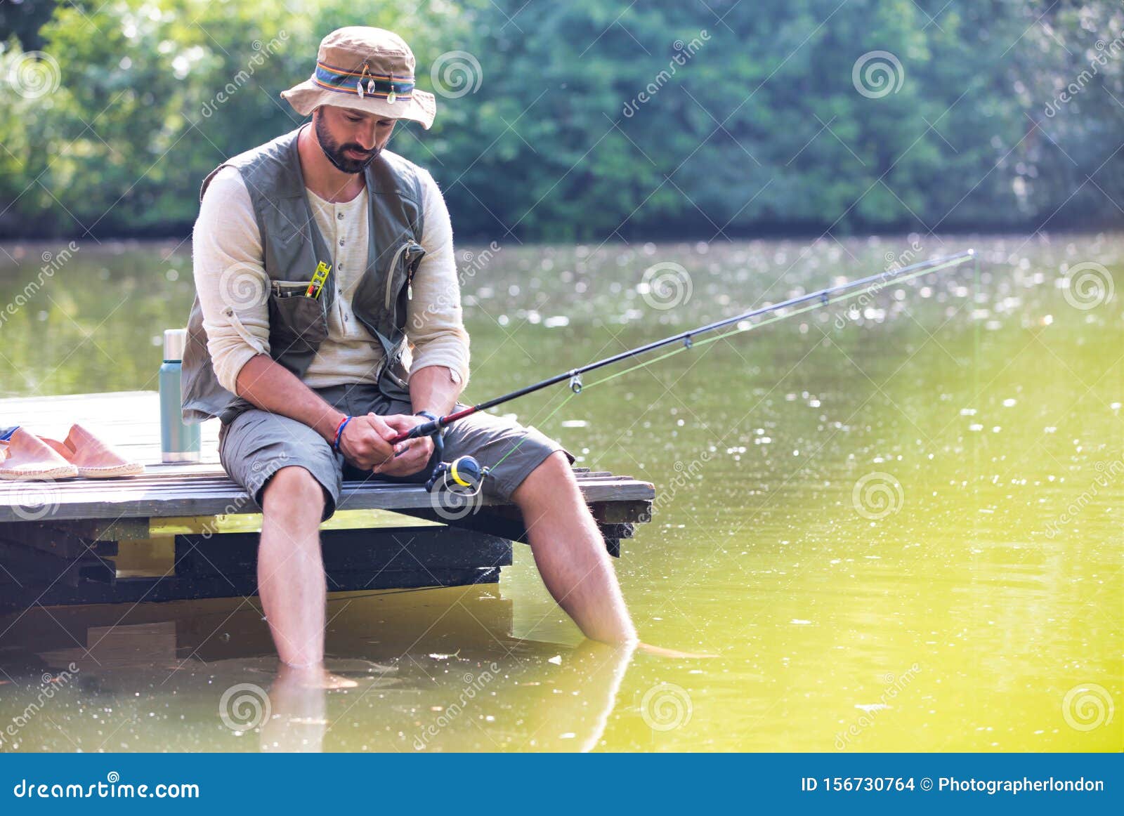 Mature Man Fishing in Lake while Sitting on Pier Stock Photo - Image of  color, casual: 156730764