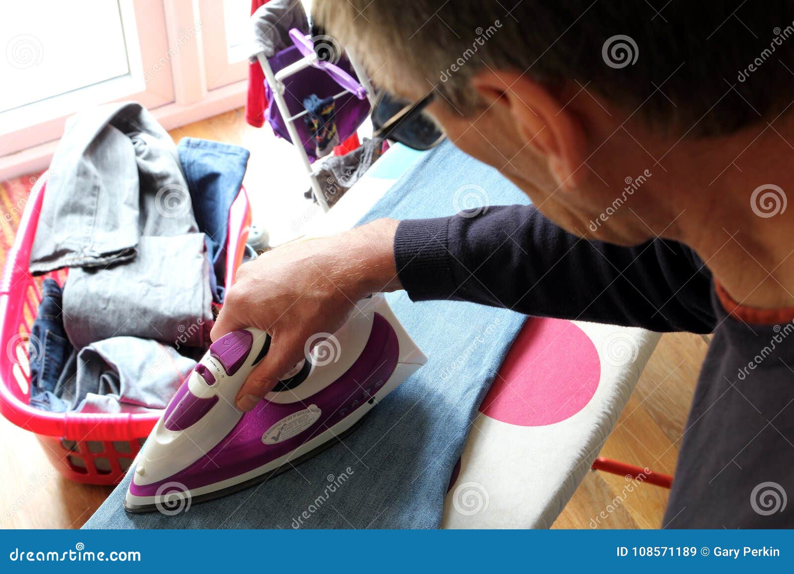 Mature Man with a Lot of Laundry and Ironing To Do Stock Image Image