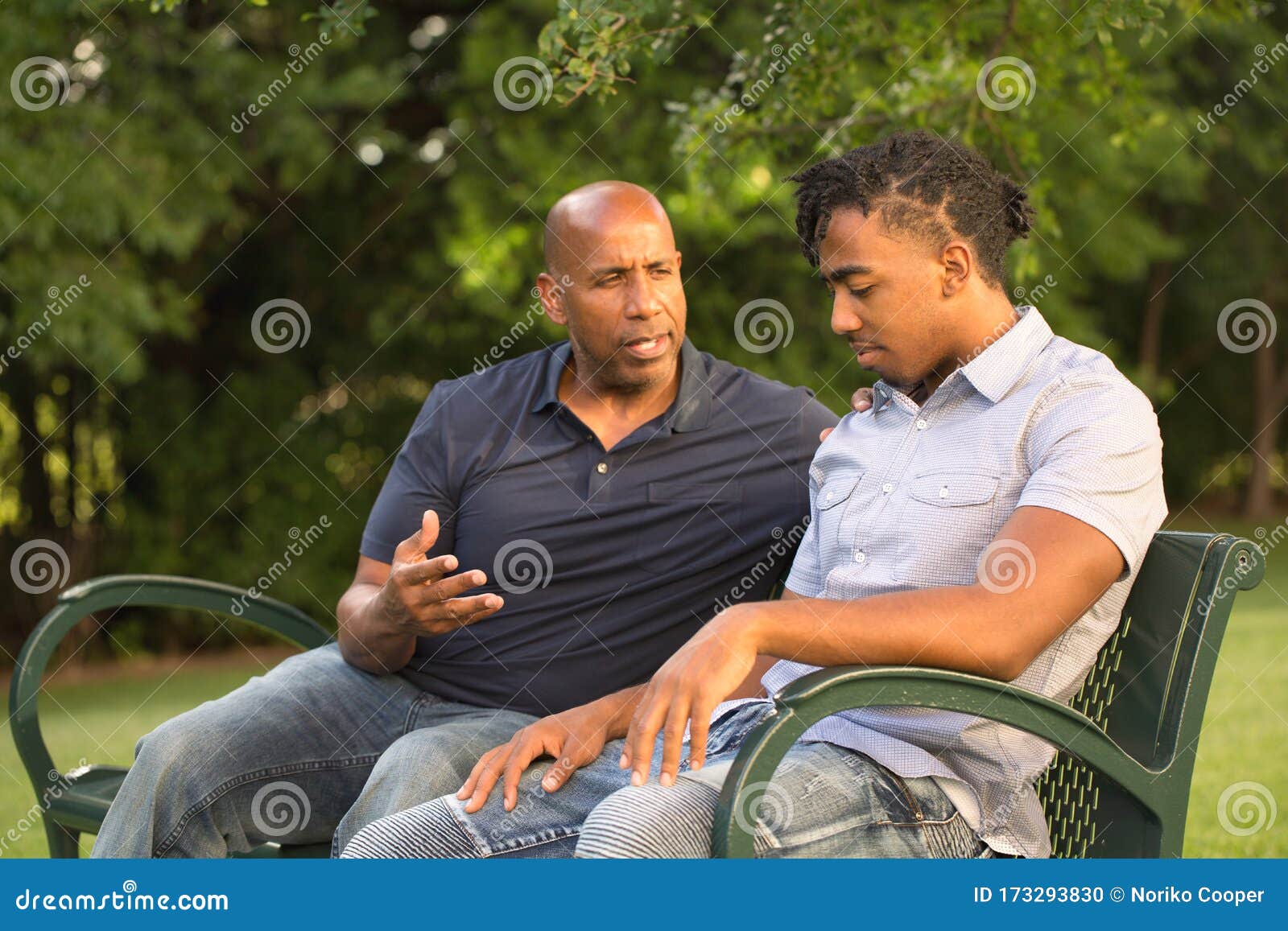 mature man mentoring and giving advice to a younger man.