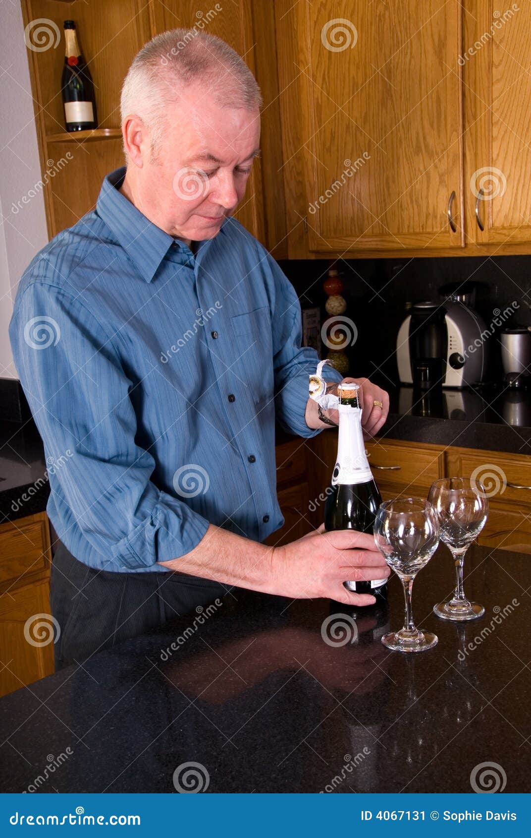 Mature man opening wine. stock image. Image of open, husband 4067131