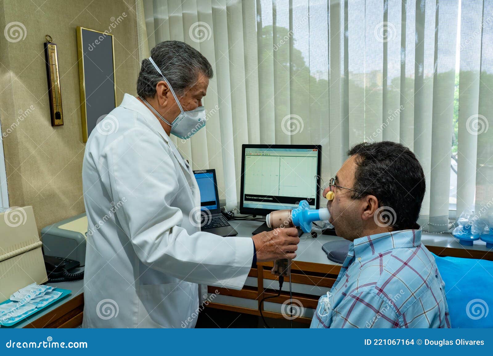 Mature Man Performing Pulmonary Function Test and Spirometry Stock