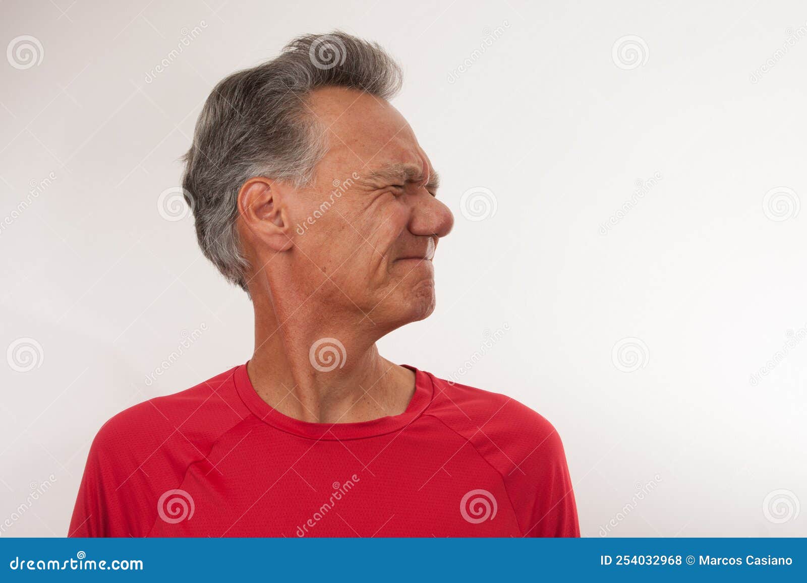 mature man stretching his neck for pain relief