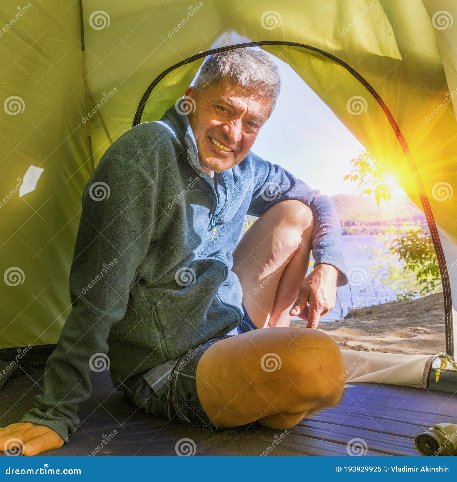 A Mature Man Sits at the Entrance To a Tourist Tent Stock Image - Image ...