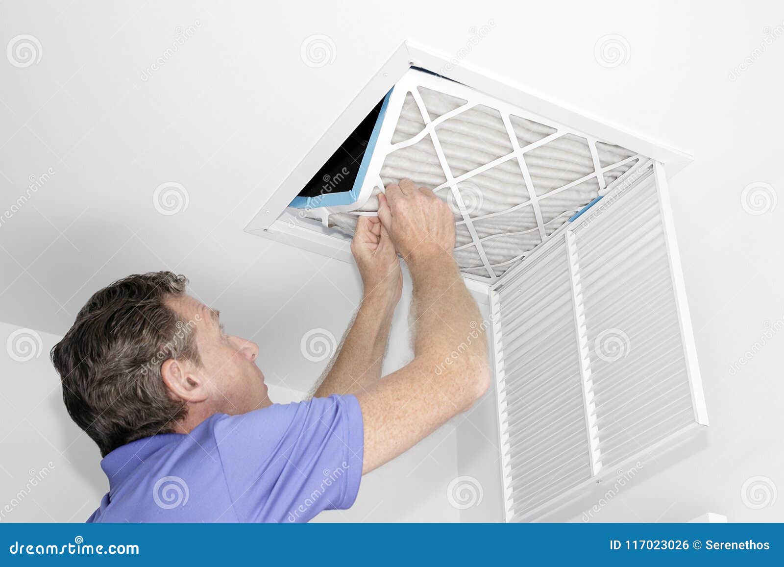 man removing dirty air filter