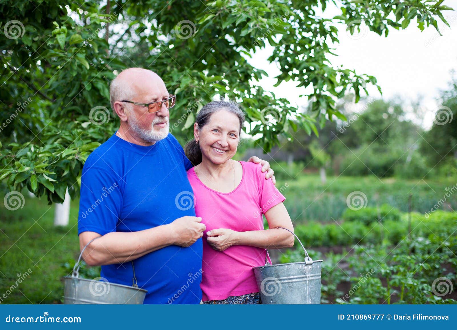 Mature Men and Women at Garden Works Stock Image - Image of person ...