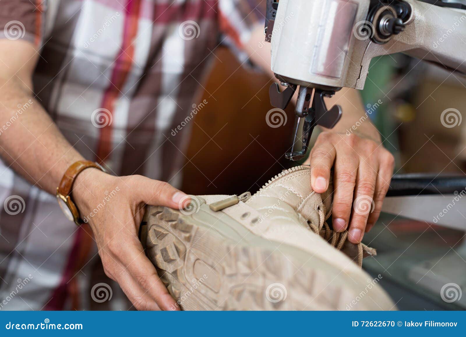 Mature Skilled Workman Sewing Leather Boots on Stitch Lathe Stock Photo