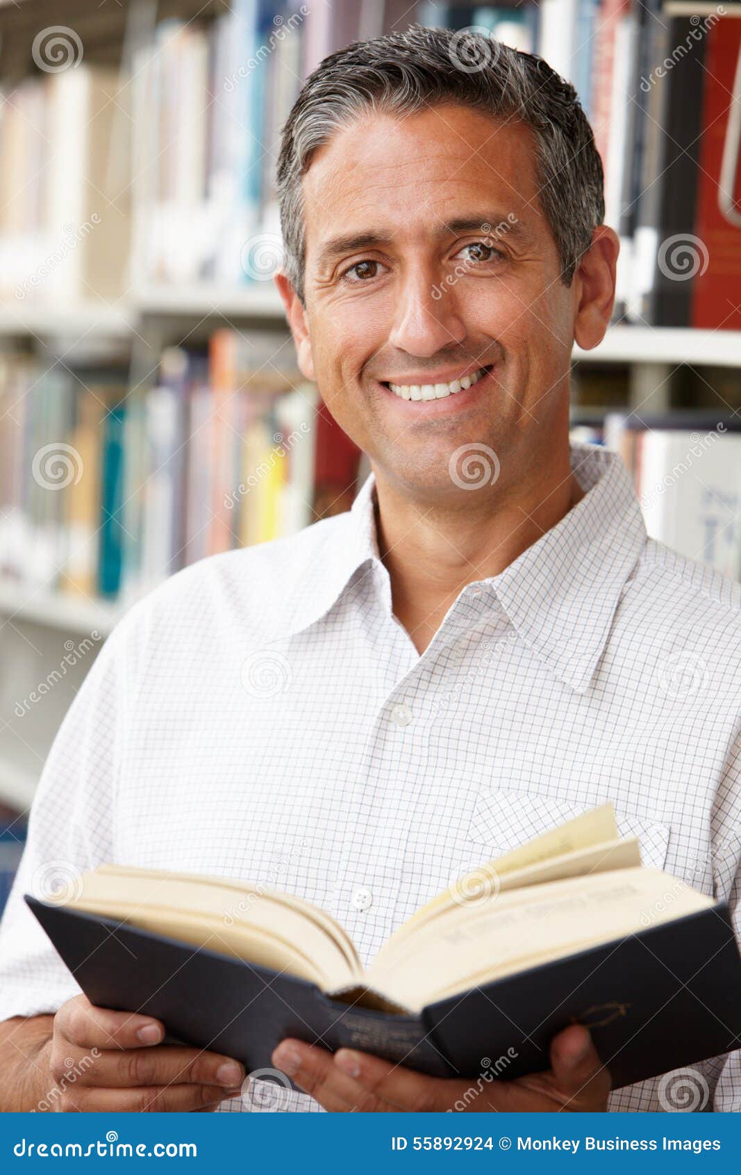 Mature student in library stock photo. Image of degree 55892924