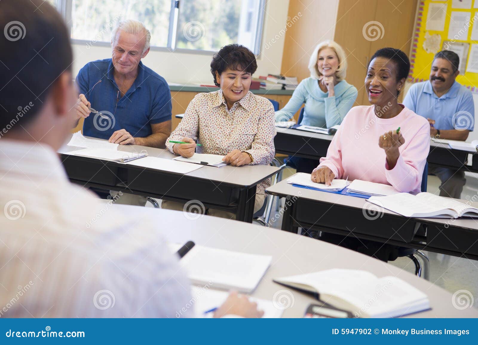 mature students and their teacher in a classroom
