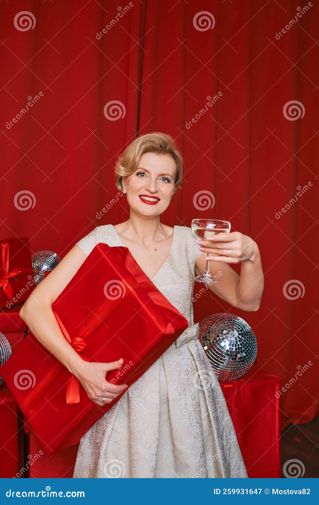 Mature Stylish Elegant Woman In Cocktail Dress With Glass Of Sparkling Wine With T Box In Her