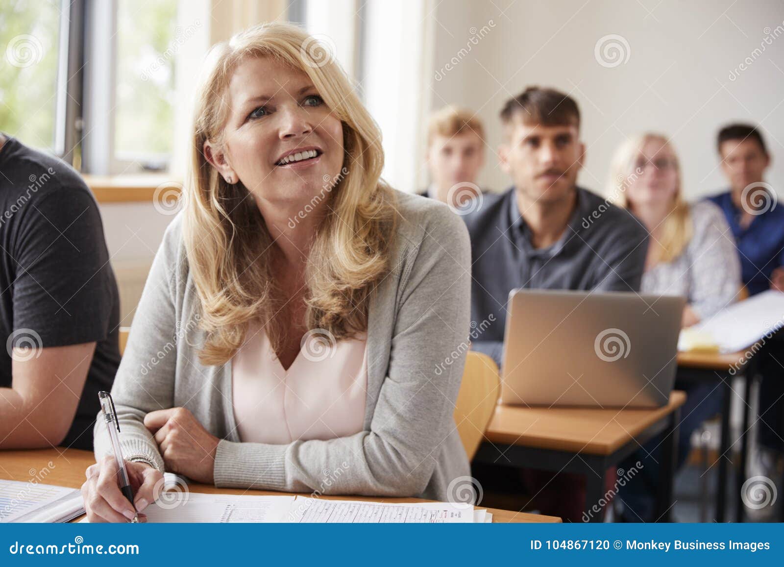 mature woman in college attending adult education class