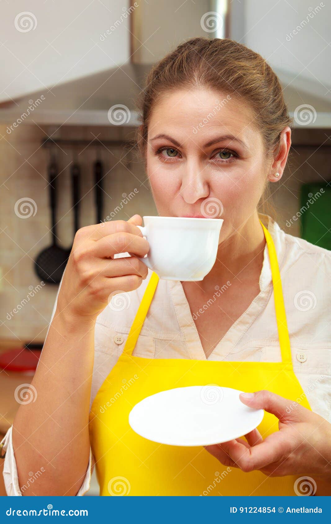 Mature Woman Drinking Cup Of C