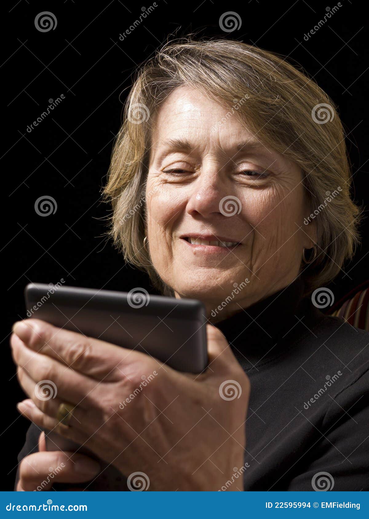 mature woman with e-reader
