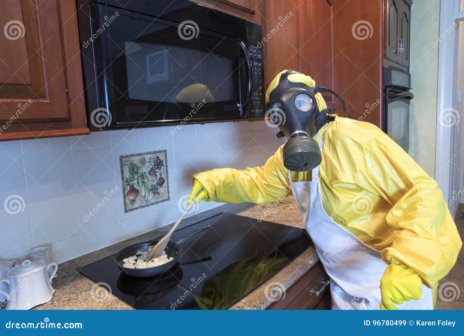 mature woman in haz mat suit cooking