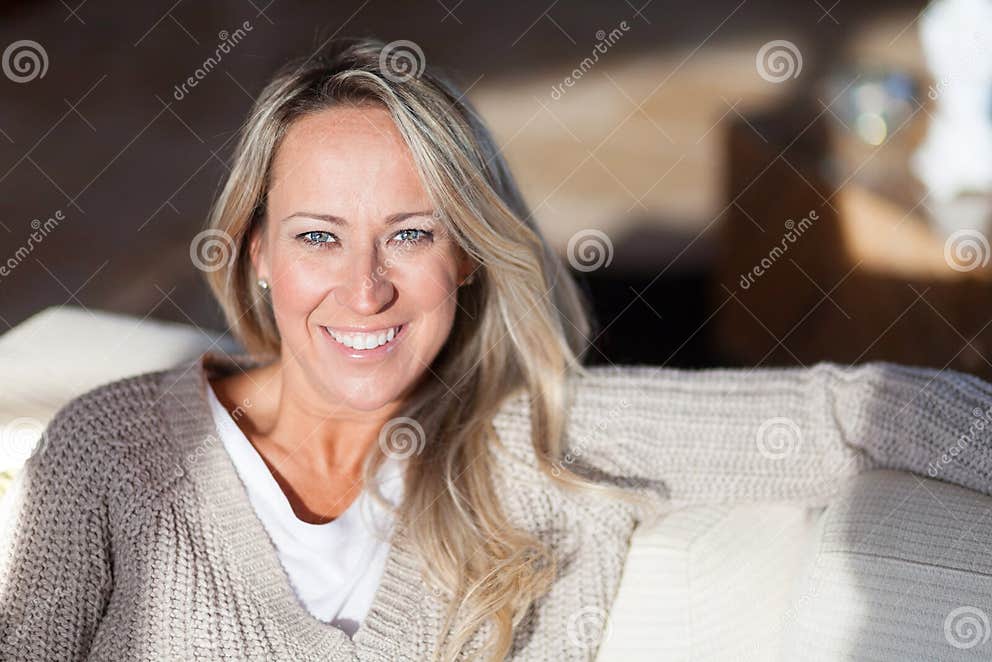 Mature Woman At Home Relaxing In The Living Room Stock Image Image