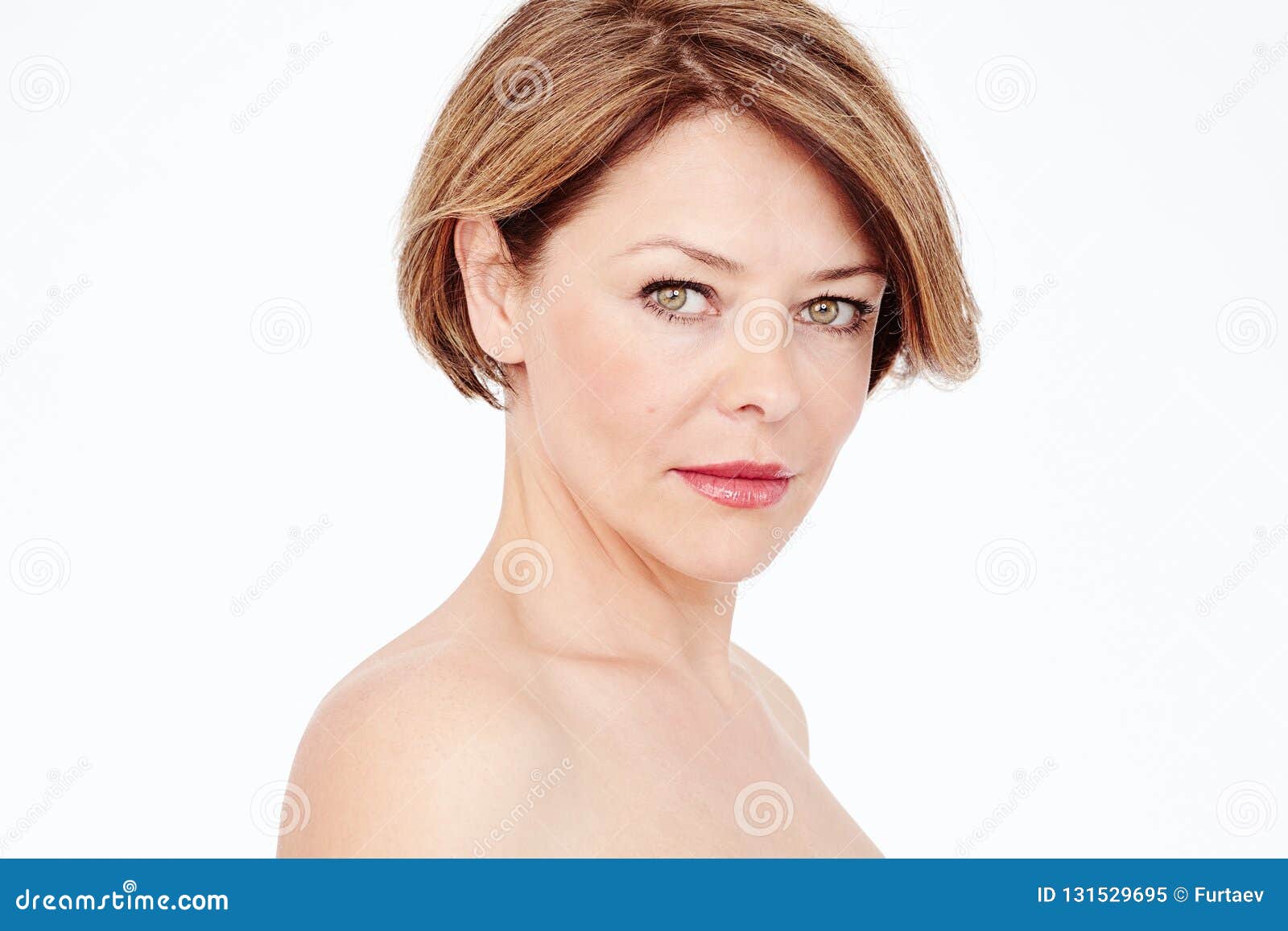 Middle-aged woman with small breasts covered with pears Isolated on white  Stock Photo