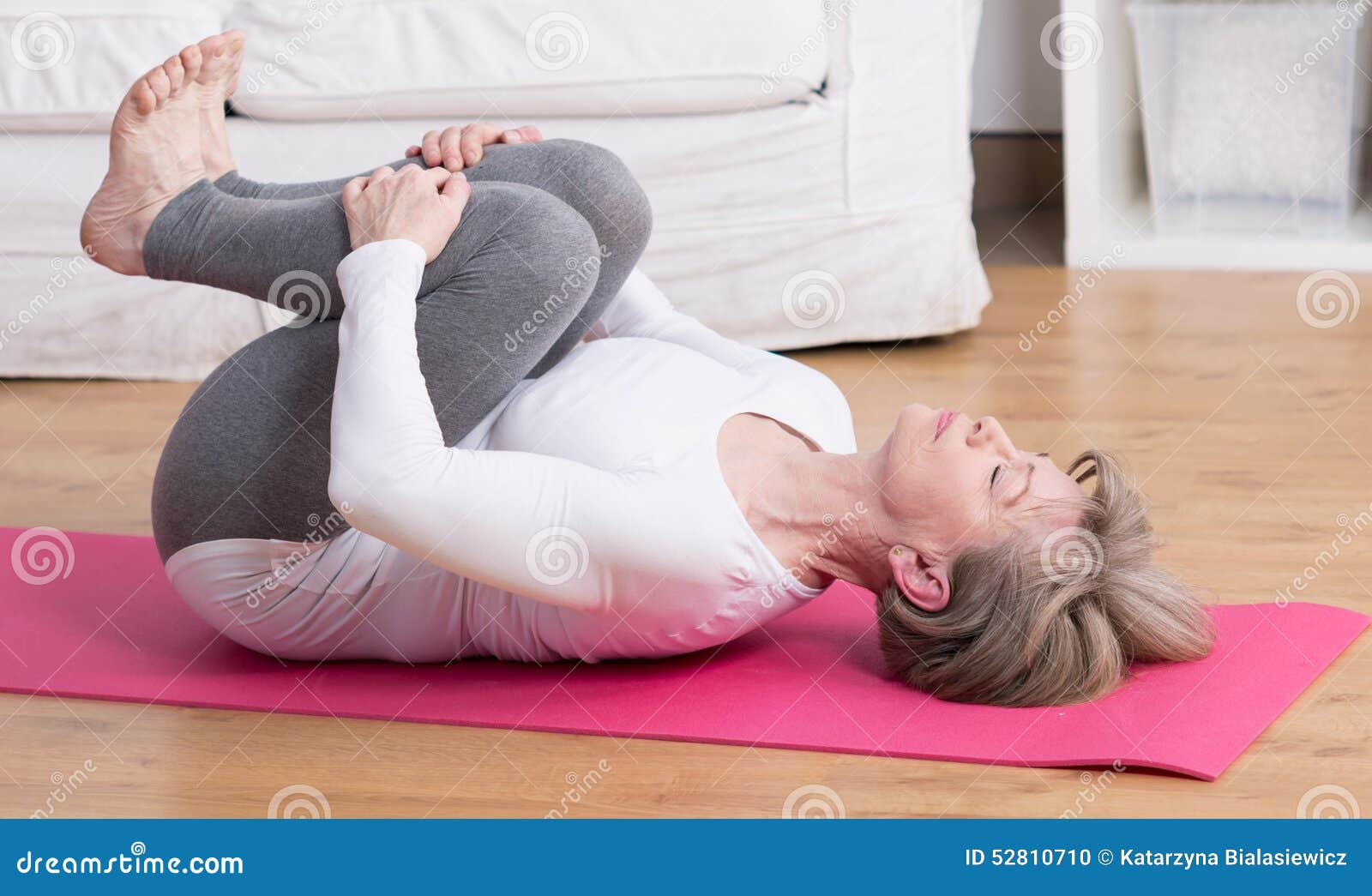 mature woman practicing pilates