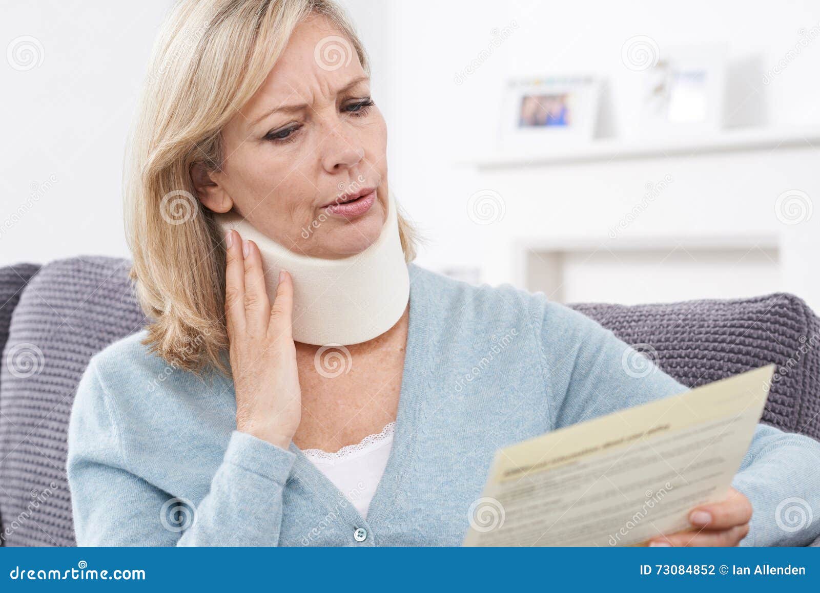 Mature Woman Reading Letter after Receiving Neck Injury Stock Photo ...