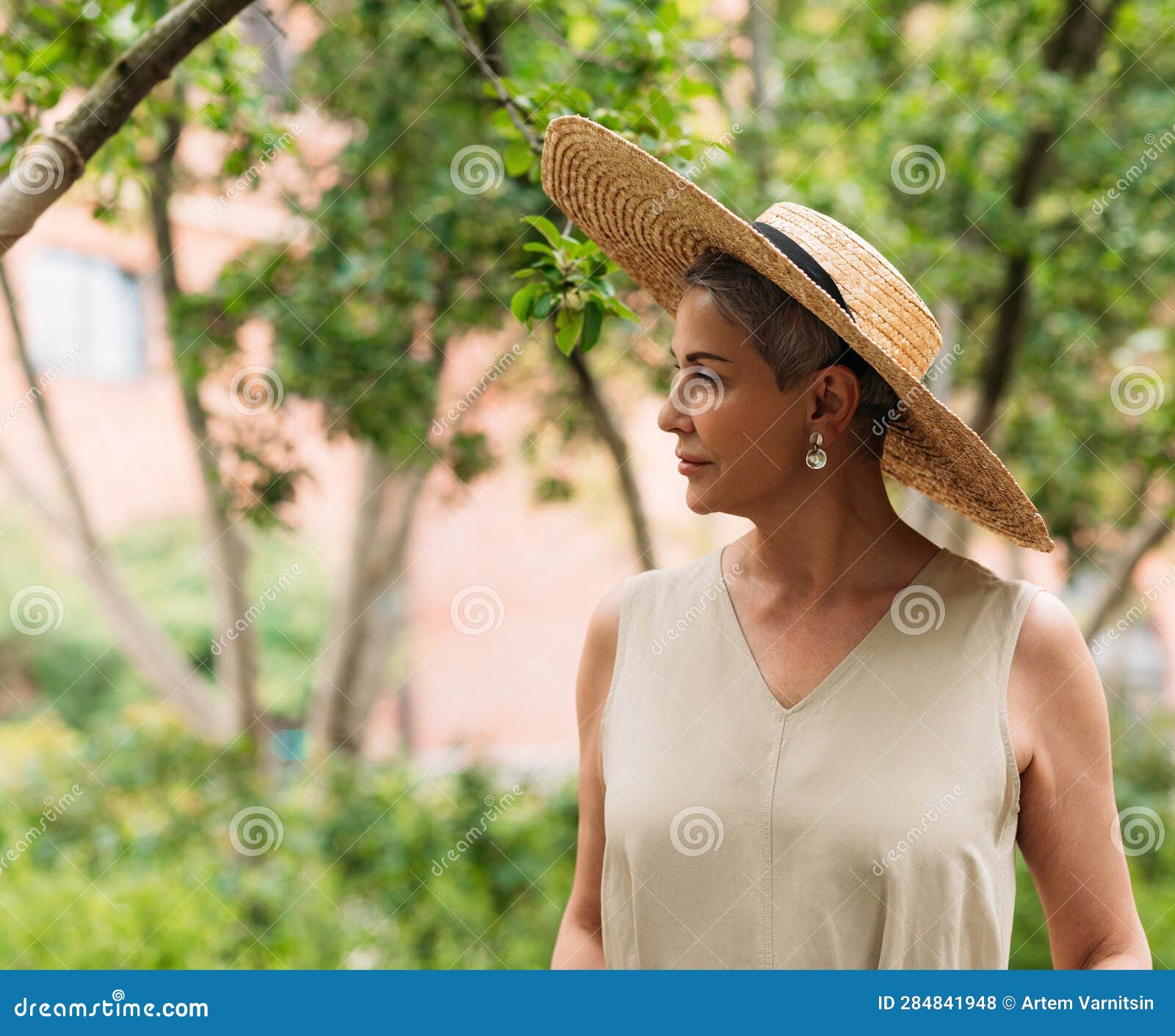 Mature Woman with Short Hair Wearing a Straw Hat Stock Photo Image of