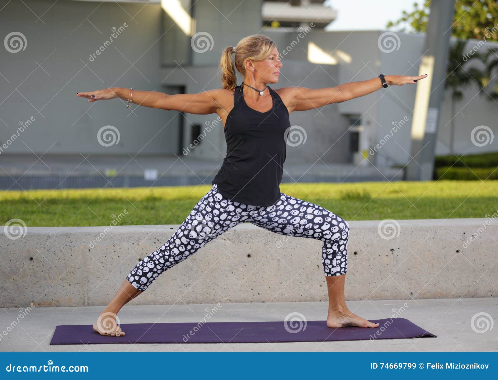 Mature Woman in a Warrior Pose Stock Image - Image of clothing, model