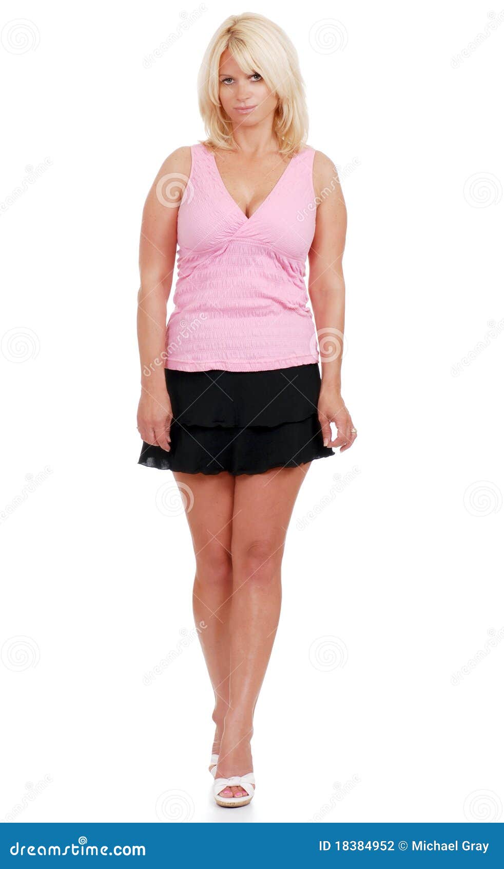 Mature Woman Wearing Short Skirt And Pink Top Stock Photo 