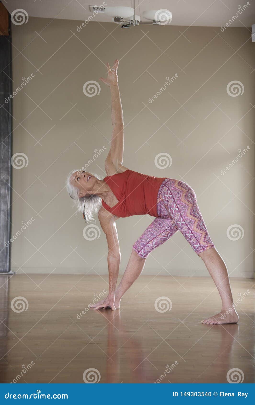 mature woman yoga studio practice yogini twisted triangle pose also known as revolved sanskrit name parivrtta 149303540